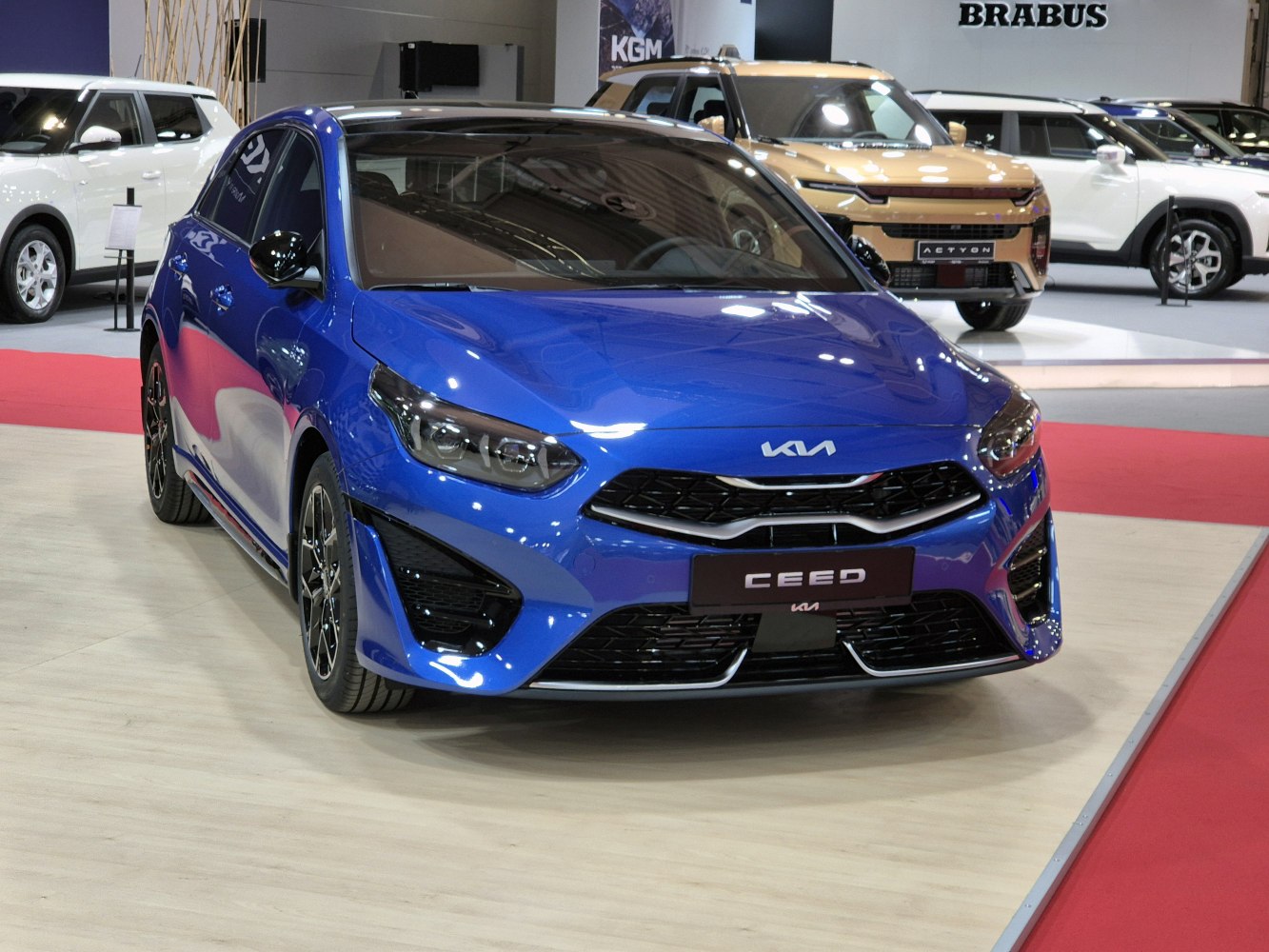 Front view of a modern hatchback with sharp headlights and sporty grille