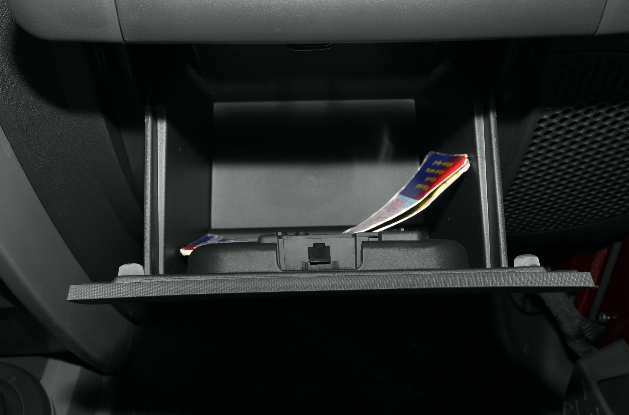 Open glove compartment with documents inside