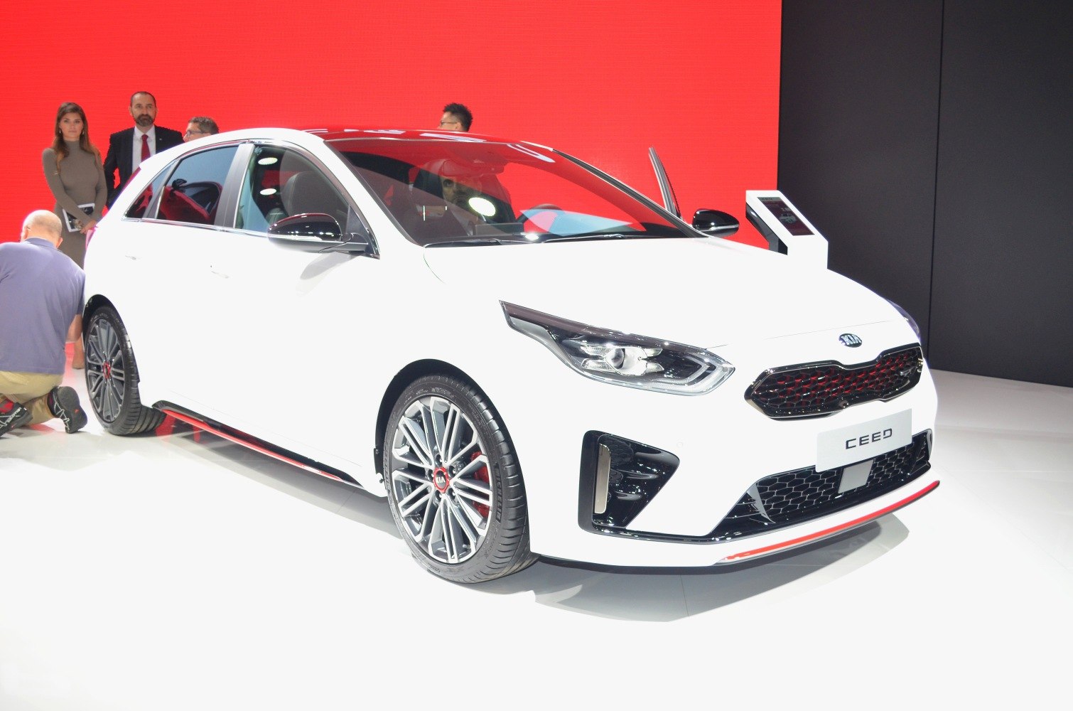 Compact hatchback with sporty alloy wheels and red accent grille