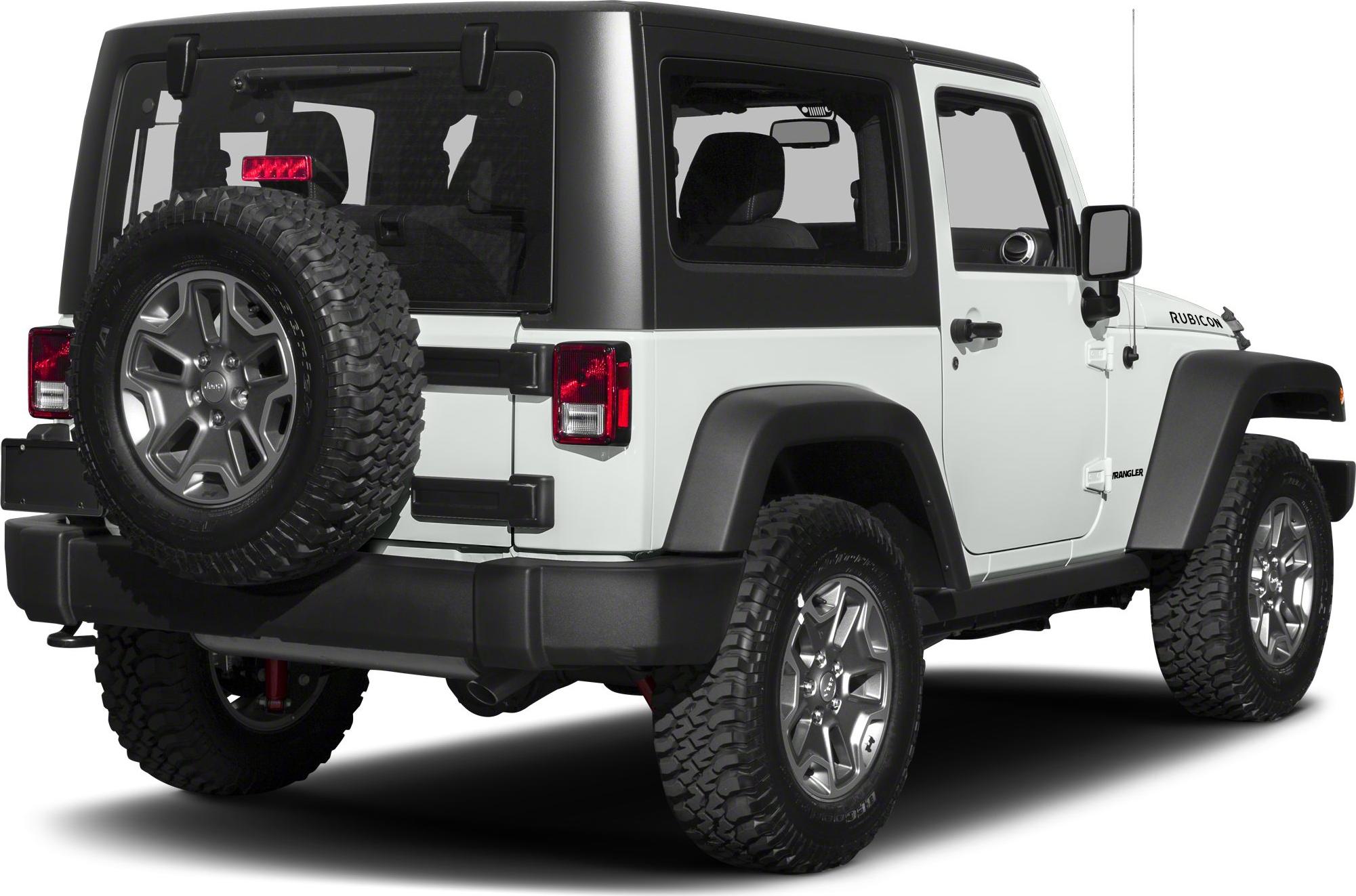 Rear side view featuring off-road tires and mounted spare wheel.