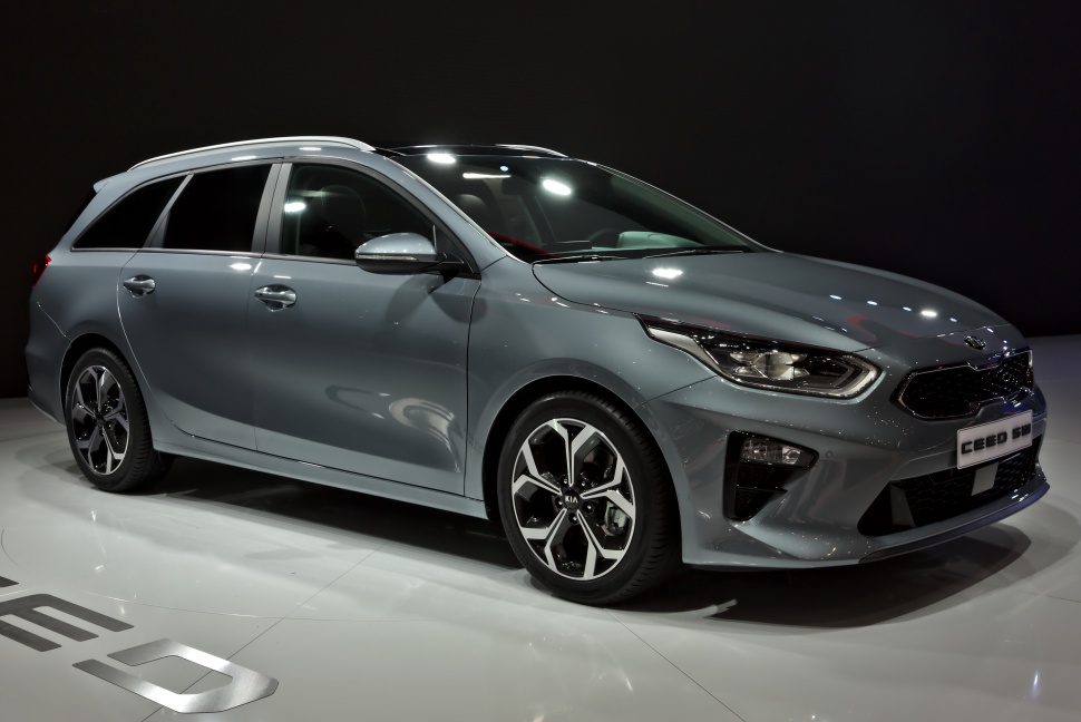 Front side view with sharp headlights and alloy wheels