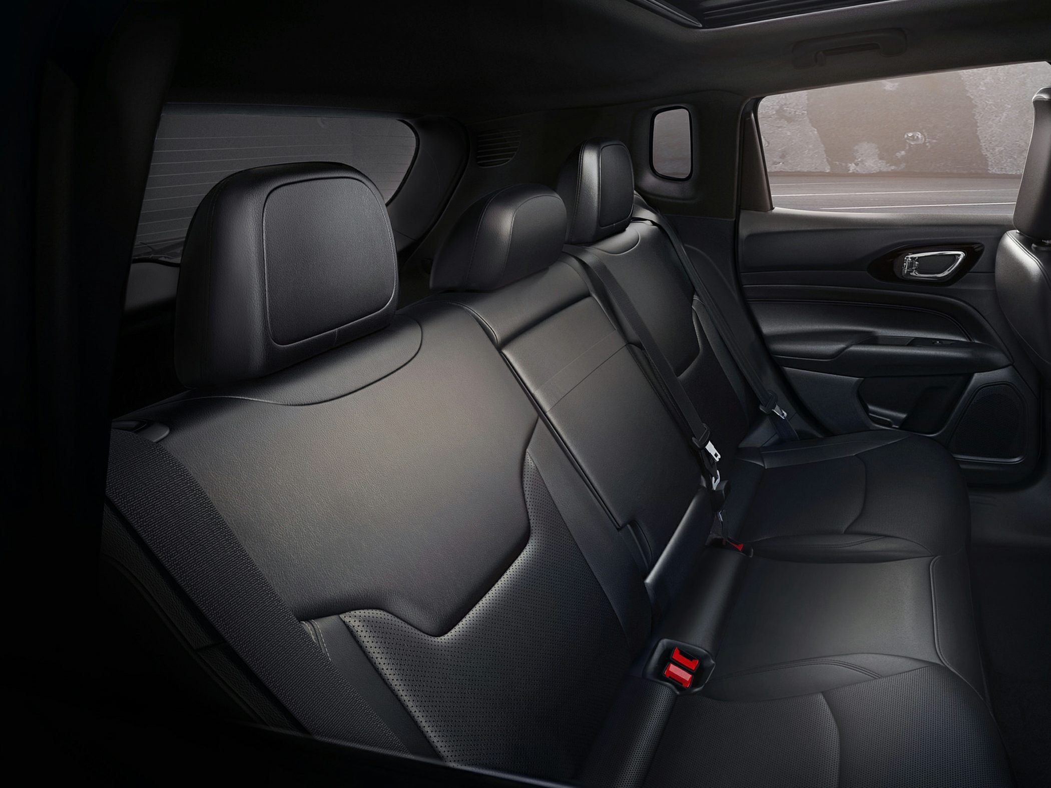 Black leather rear seats with headrests and seat belts