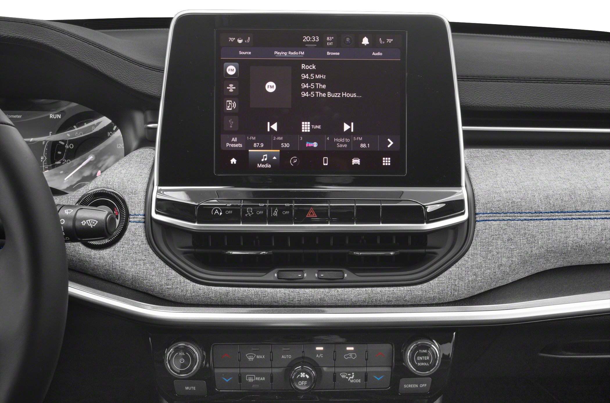 Infotainment touchscreen and climate control panel with fabric dashboard trim and illuminated buttons.