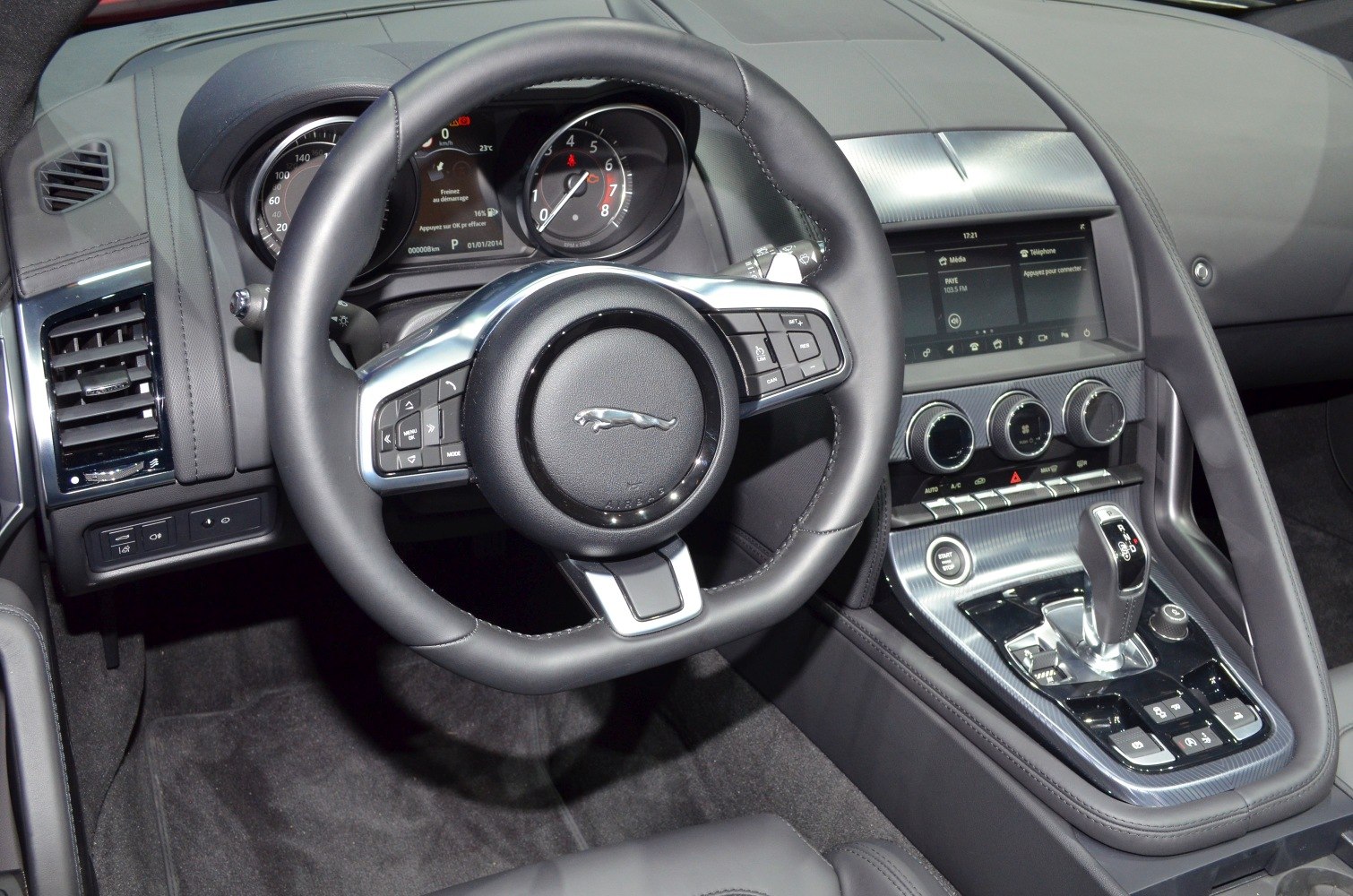 Steering wheel, instrument cluster, and center console with gear selector