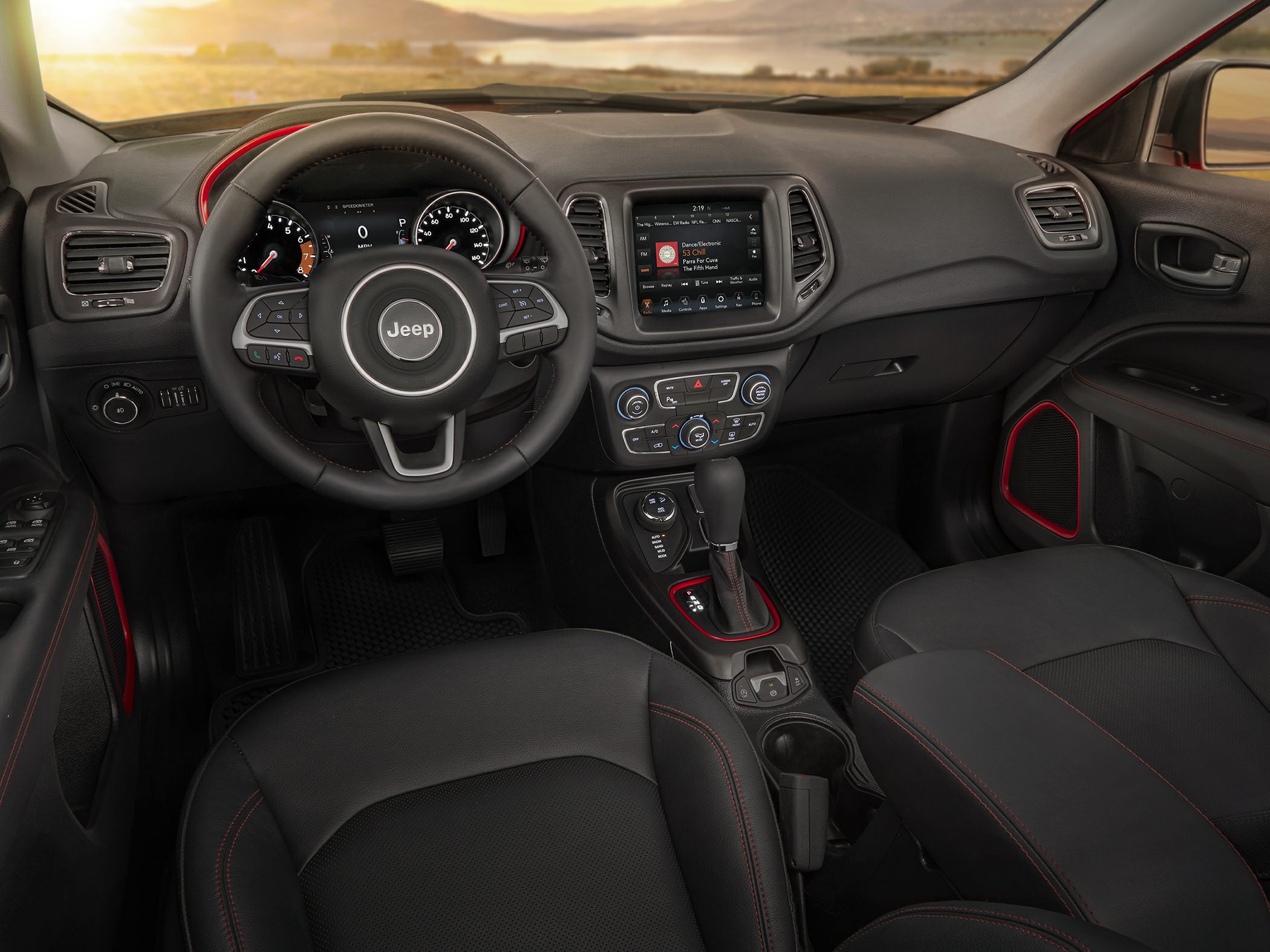 SUV interior with dashboard, steering wheel, and touchscreen infotainment system