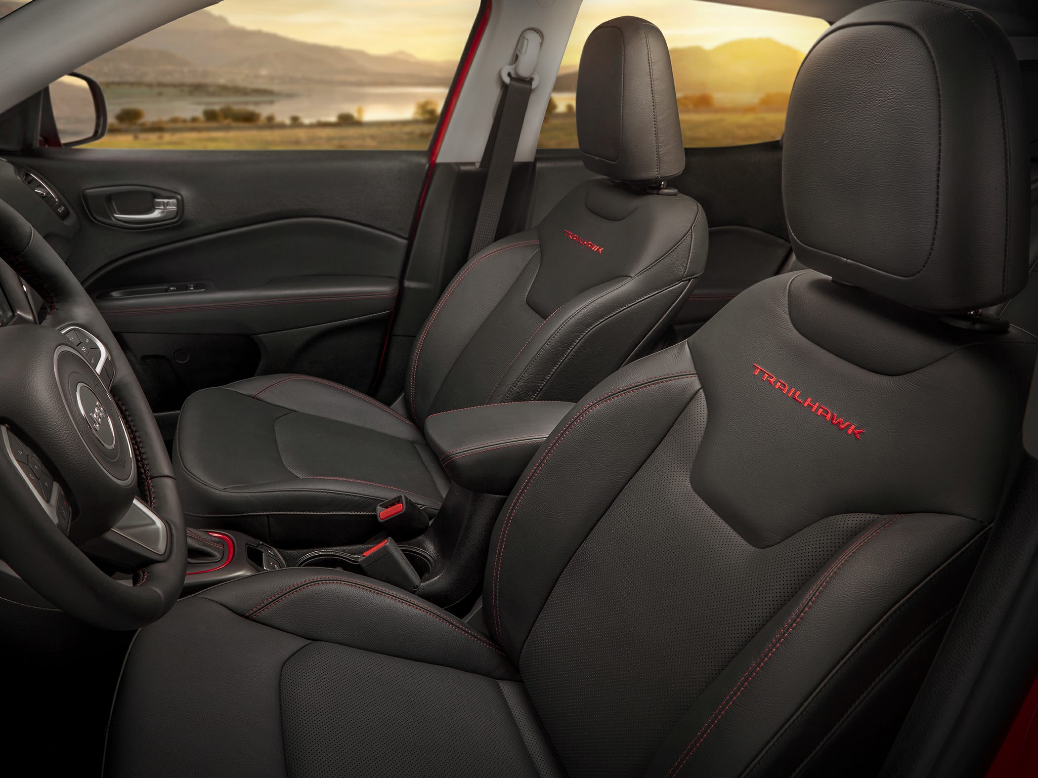 Close-up of black leather Trailhawk seats with red stitching in car interior