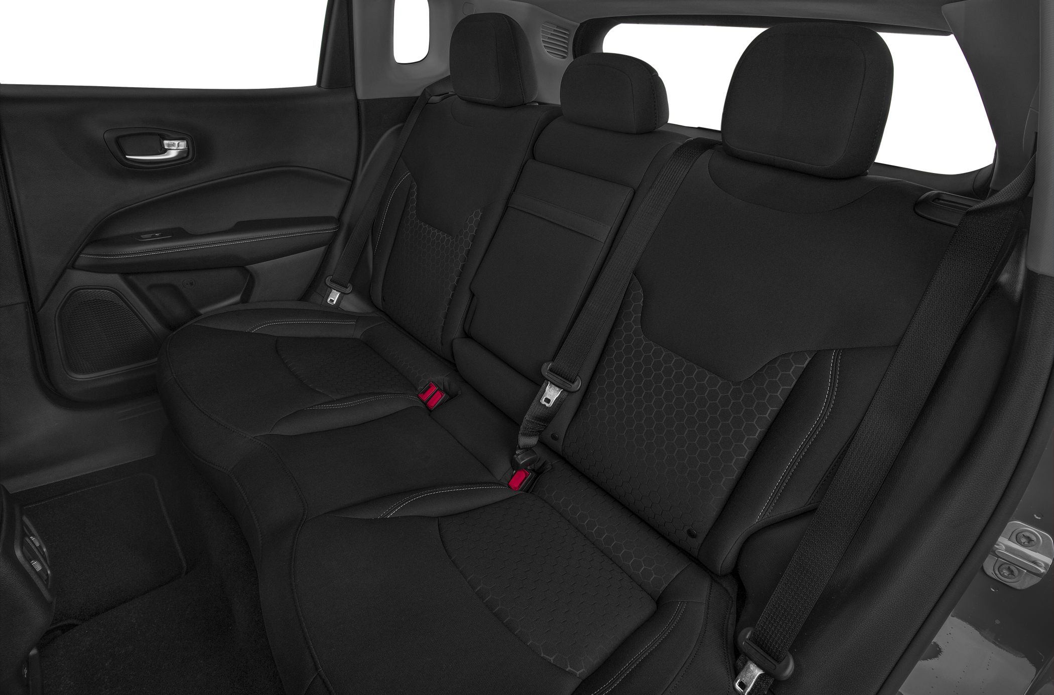 Rear seats with black upholstery and hexagonal patterns