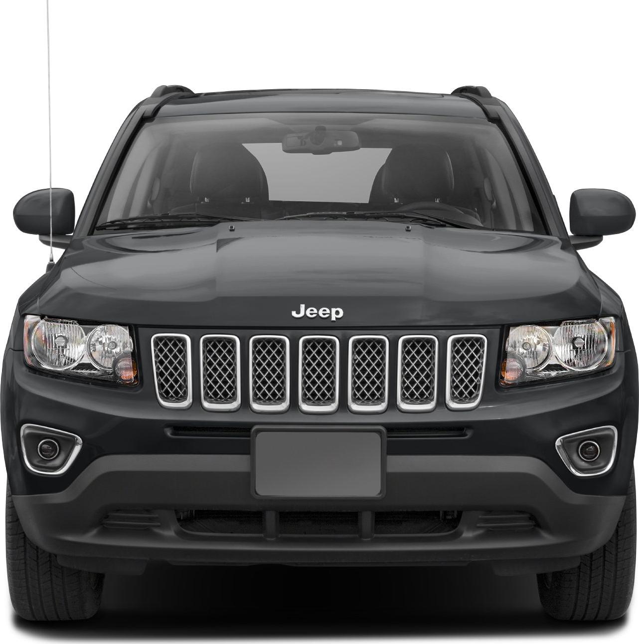 Seven-slot front grille and dual headlights of a black SUV