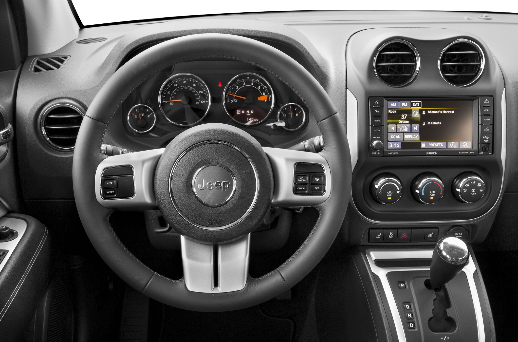 Steering wheel, instrument cluster, and center console with infotainment and gear shift