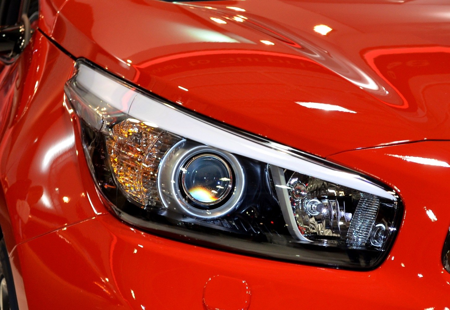 Close-up of projector headlight and turn signal assembly