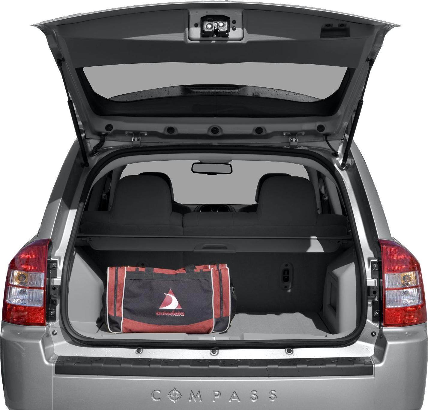 Open trunk with visible rear cargo space and rear seats.