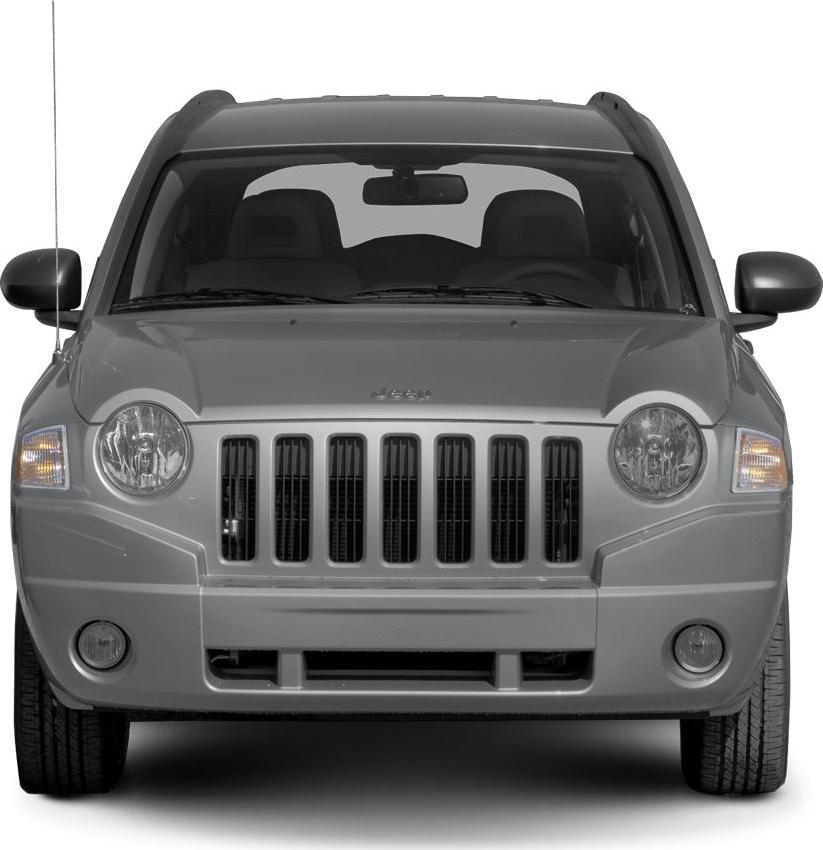 Front view showing distinctive seven-slot grille and round headlamps
