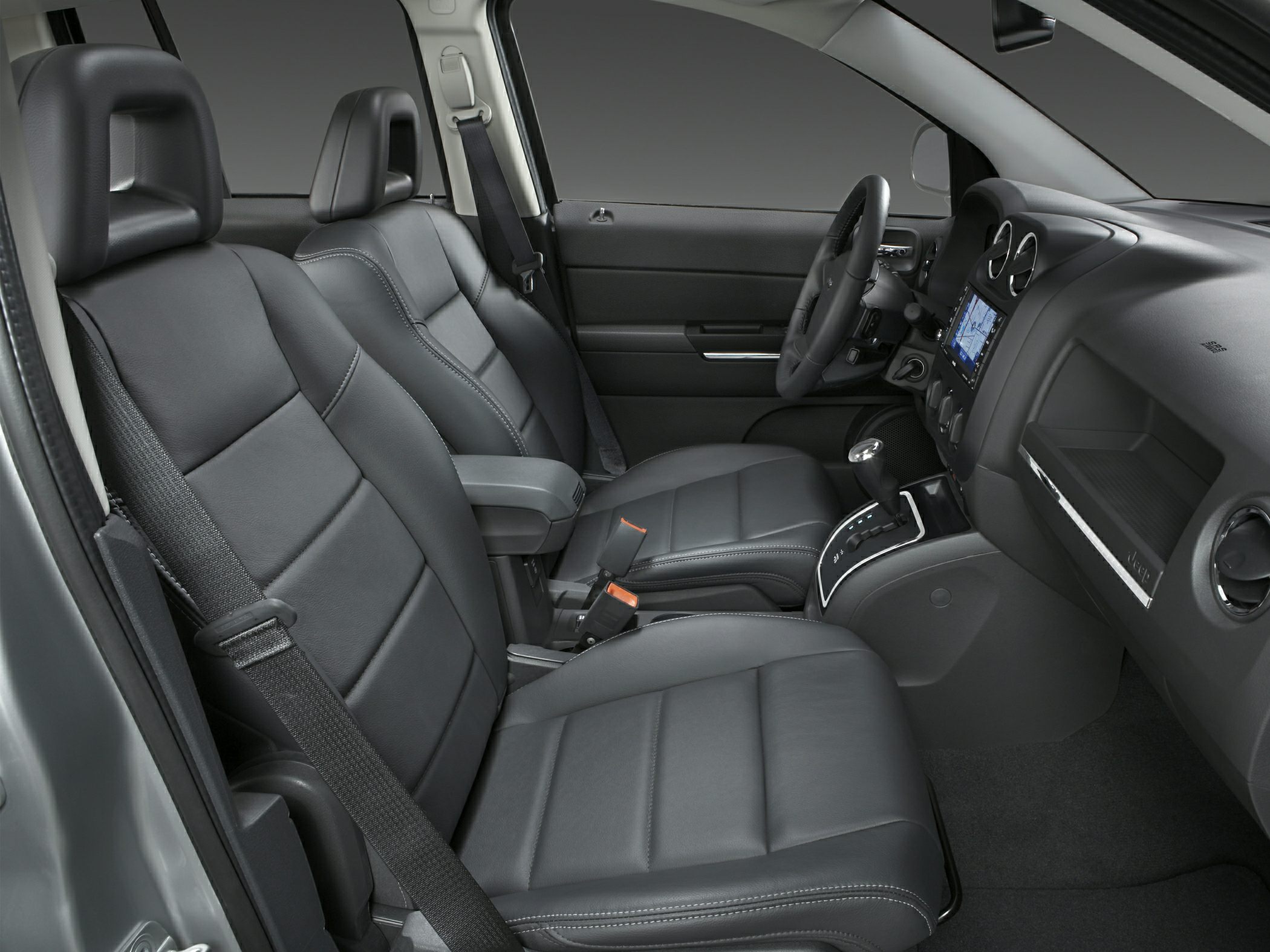 Black leather seats and modern dashboard with center console gear shift
