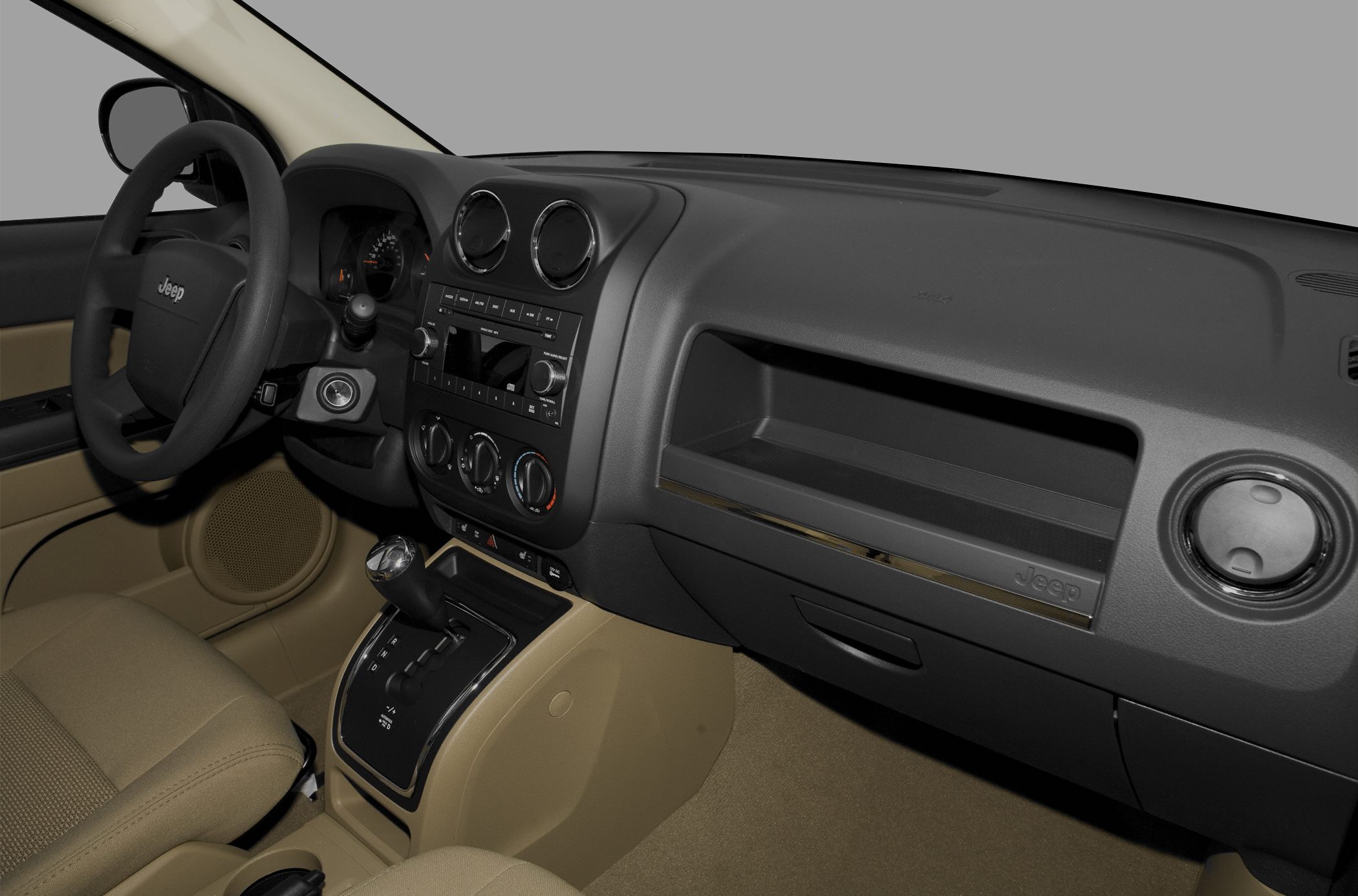 Dashboard, steering wheel, and center console with gear shift