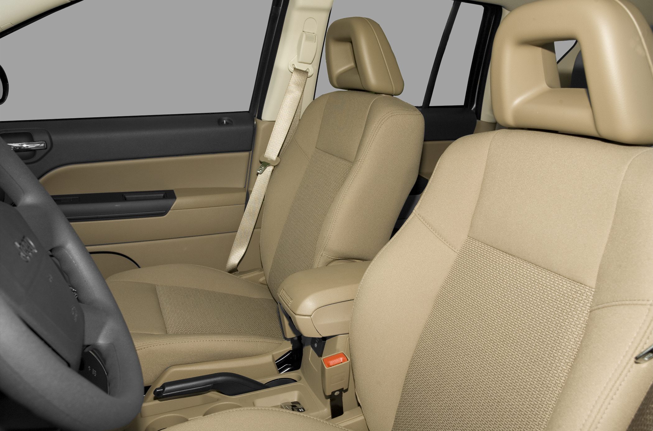 Beige front fabric seats with armrest and seatbelt