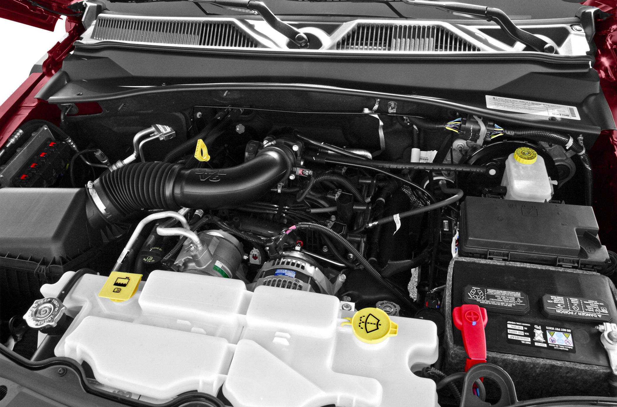 Engine bay with V6, battery, and fluid reservoirs
