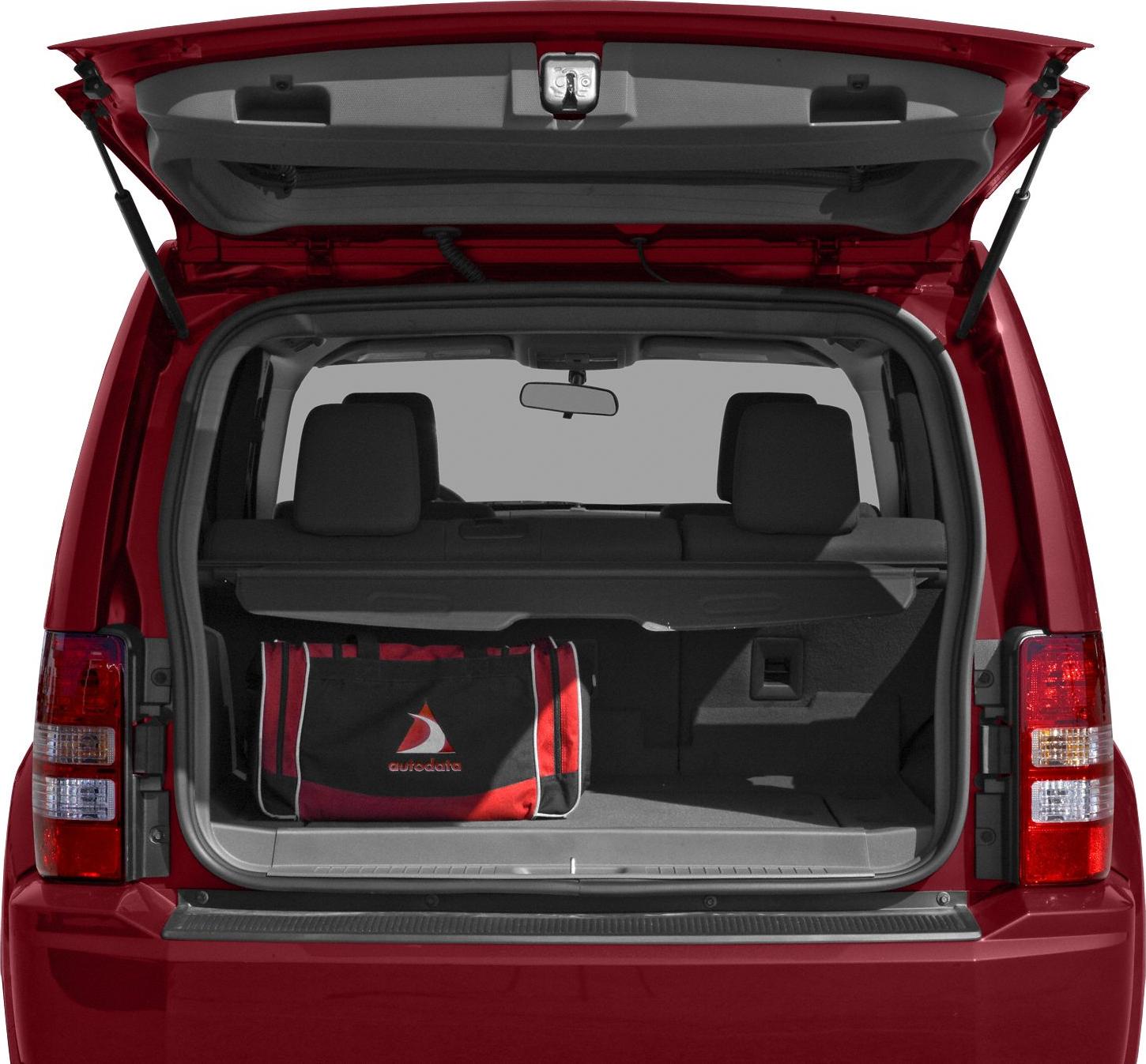 Open rear hatch revealing spacious SUV cargo area with rear seats