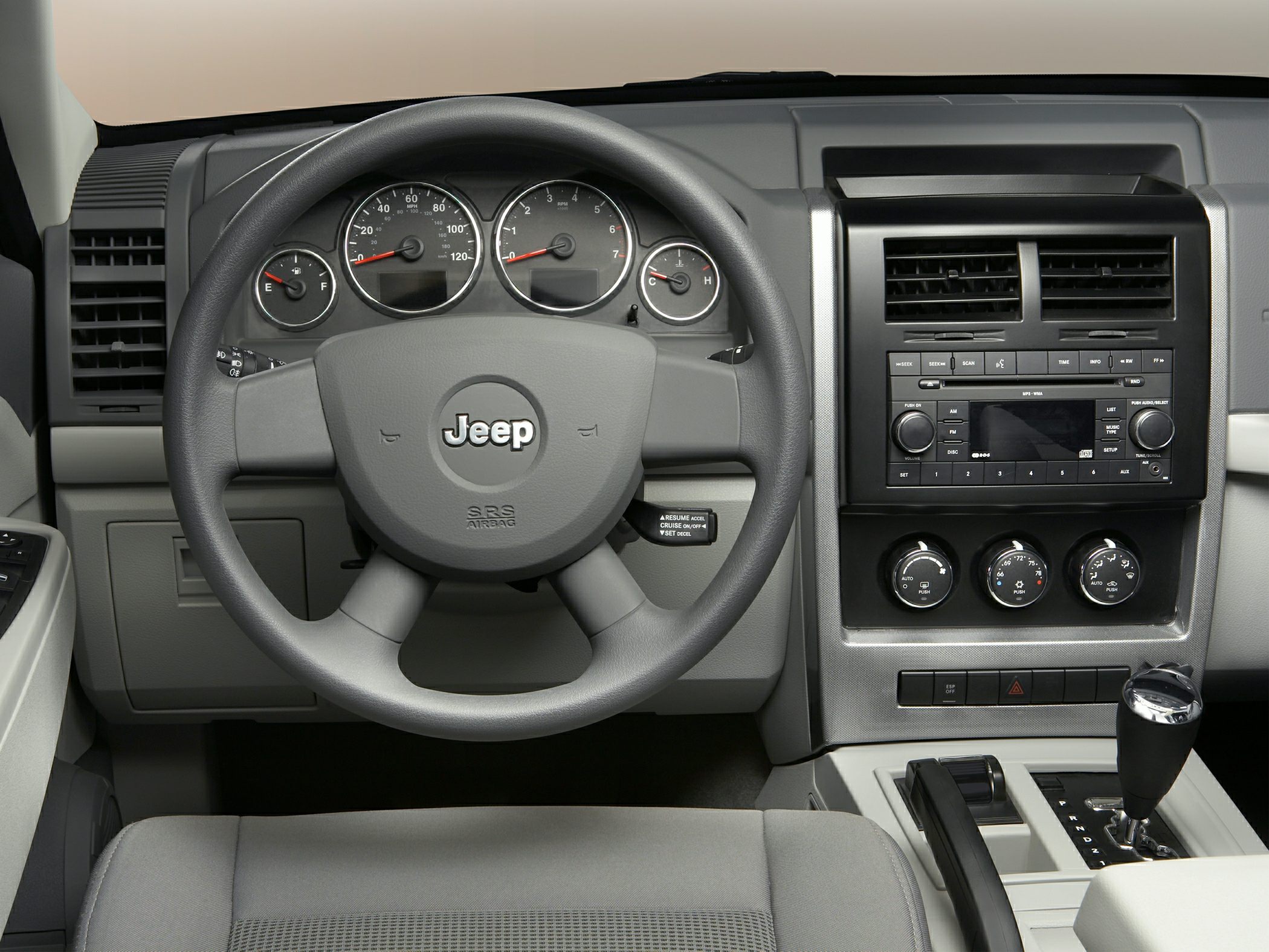 Dashboard, steering wheel, instrument cluster, center console with controls