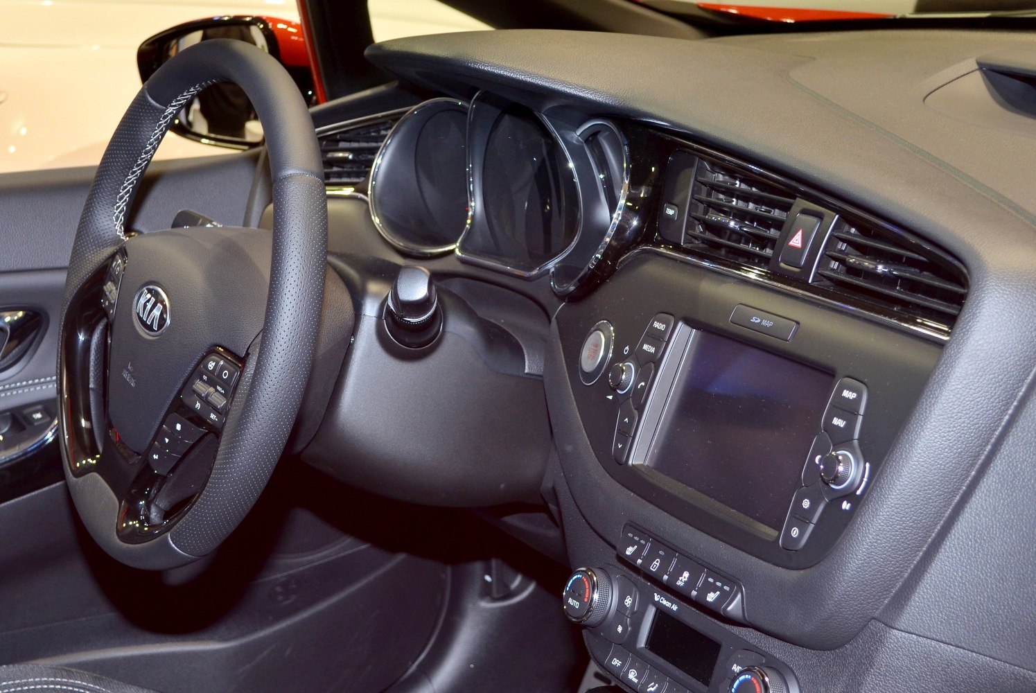 Steering wheel, instrument cluster, and dashboard controls in car interior