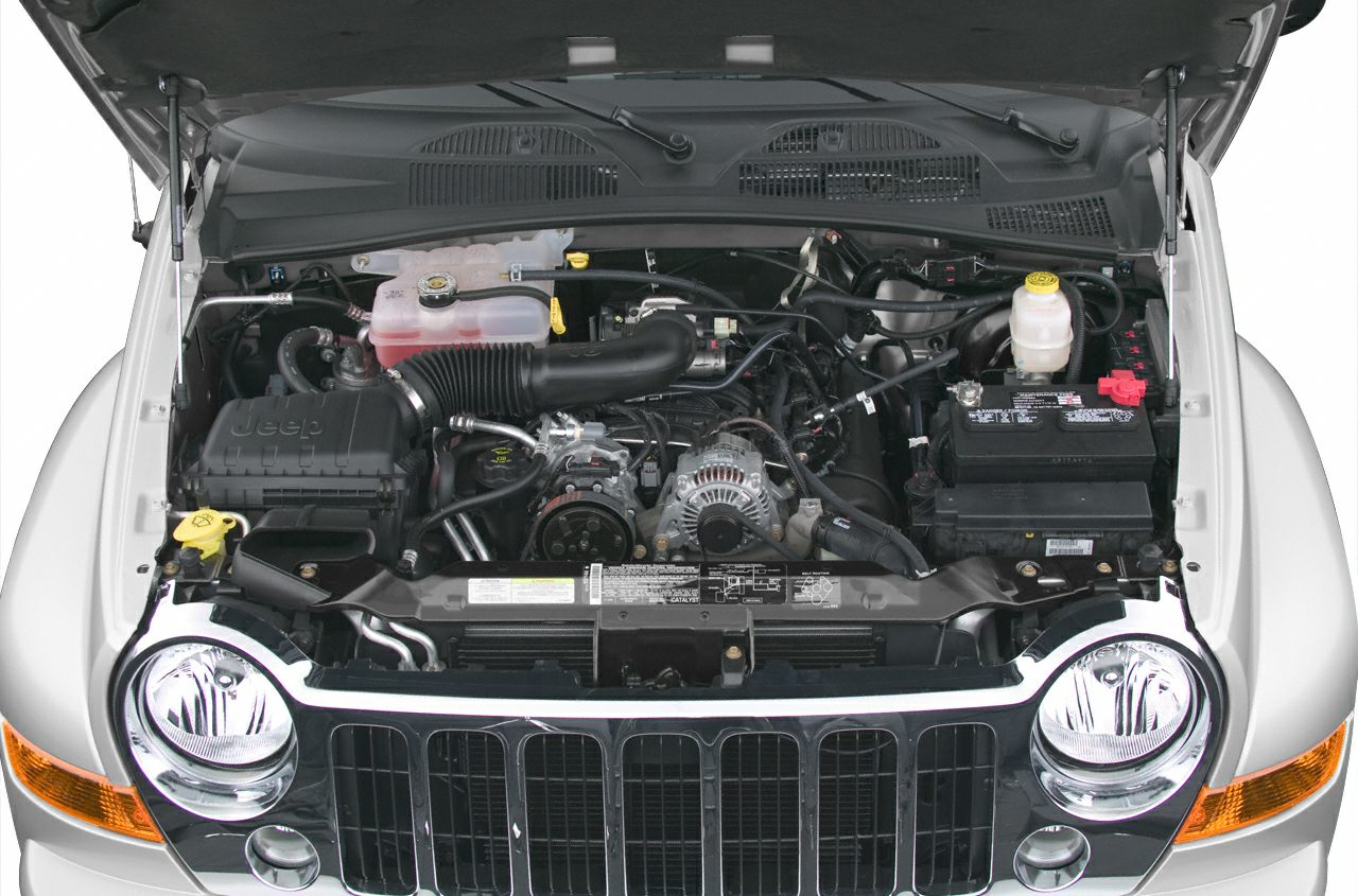Open engine bay with front grille and headlights visible