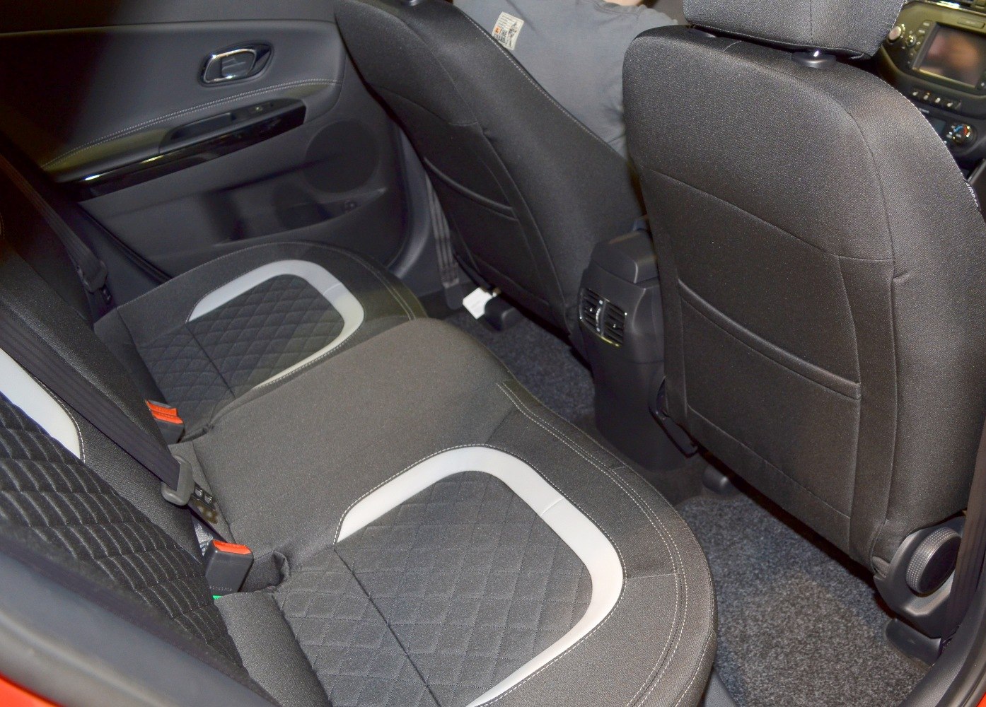 Rear seat with quilted fabric upholstery and visible door panel