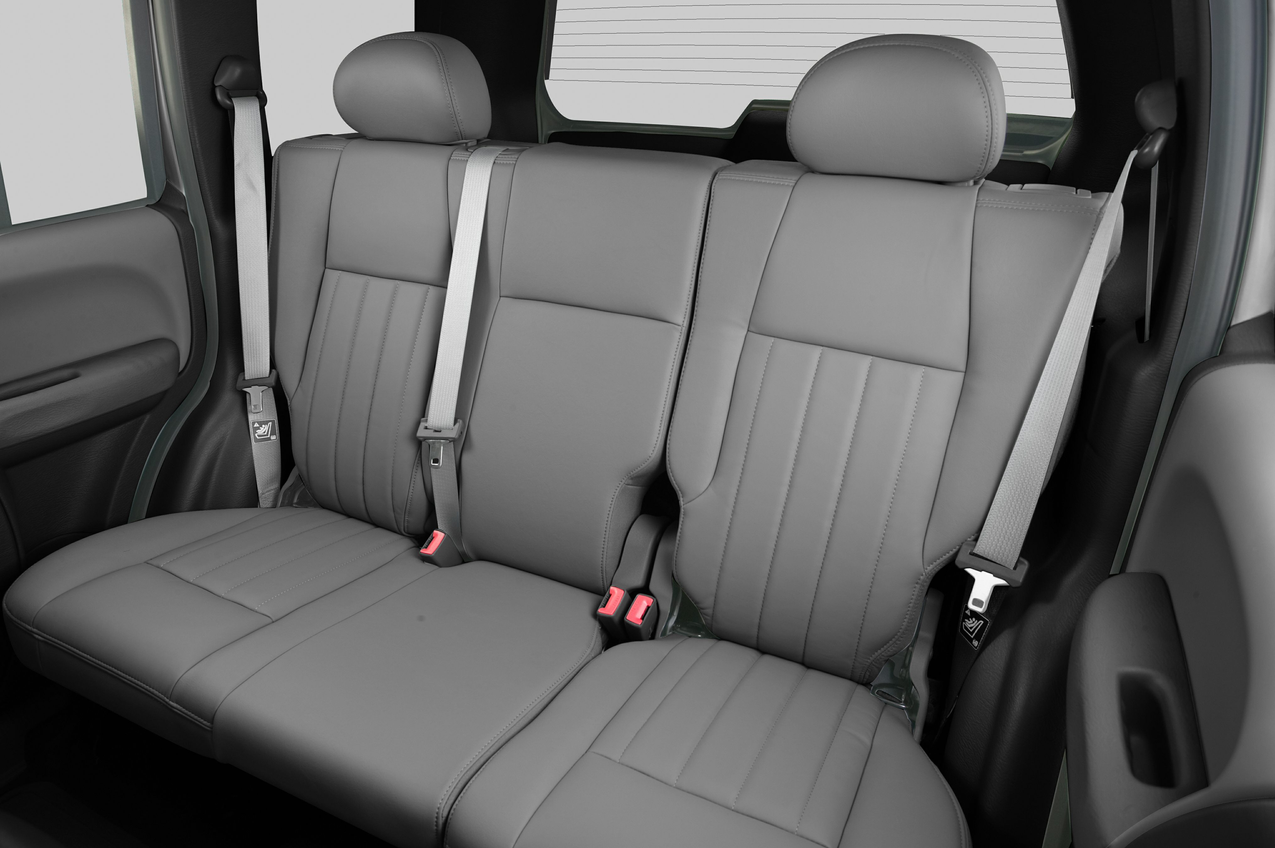Rear seat with leather upholstery and headrests.