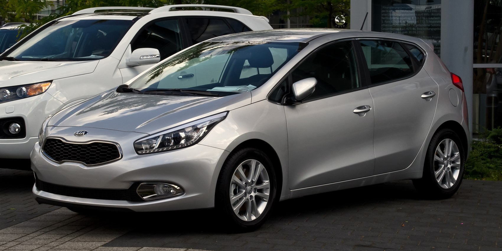 Silver hatchback with distinctive grille and sleek headlights