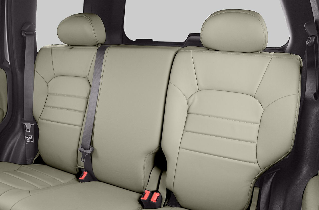 Beige leather rear seats with headrests and seatbelt