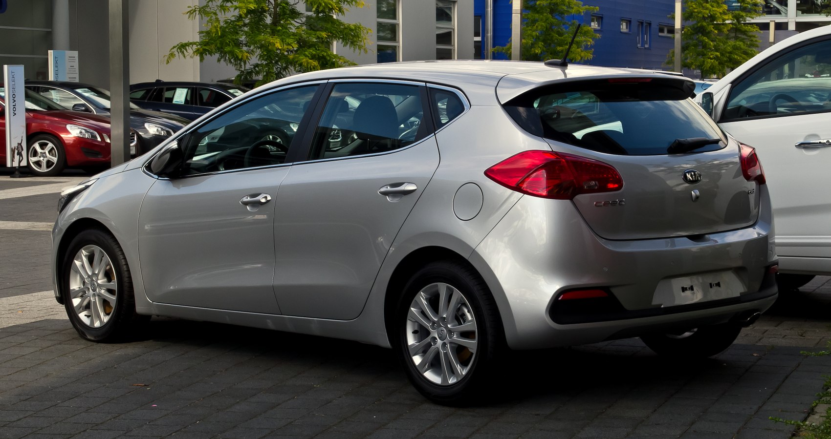 Rear side view of a silver hatchback with alloy wheels and five doors.