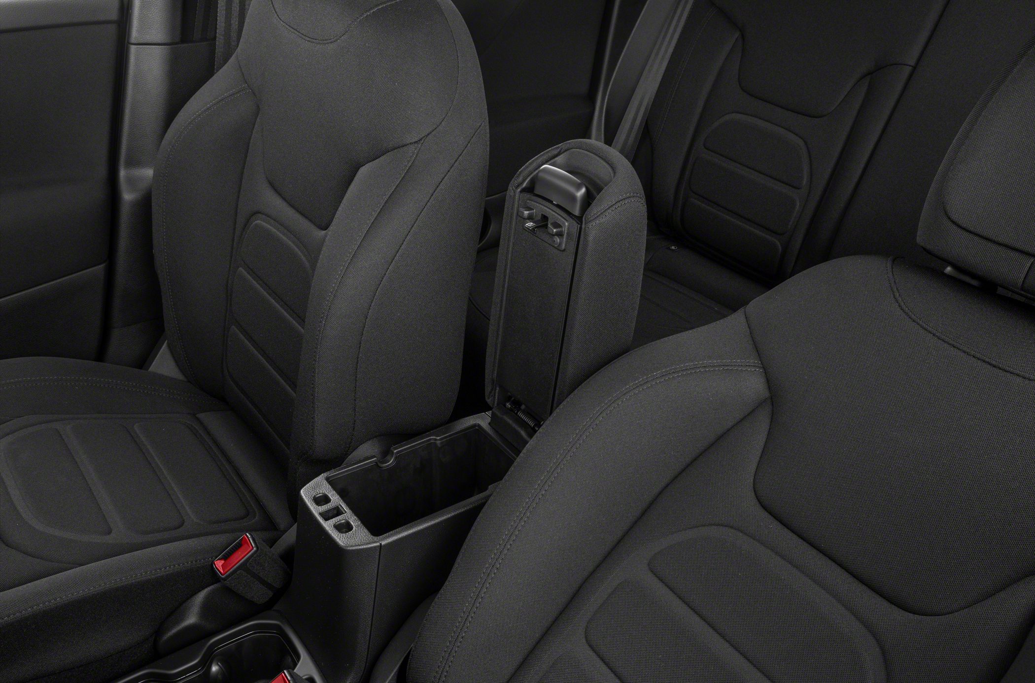 Center armrest with storage and detailed seat upholstery
