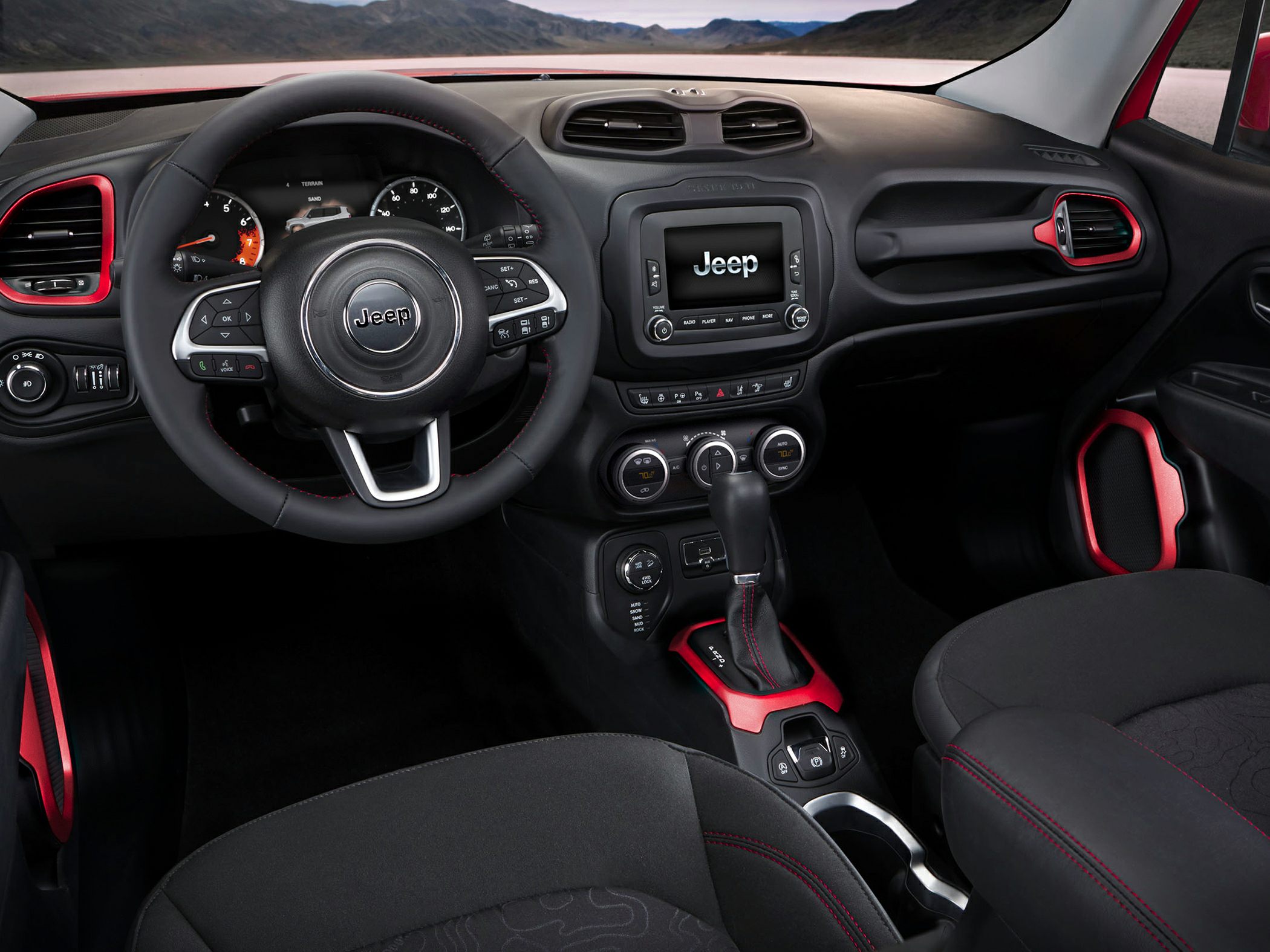Dashboard with steering wheel and center console featuring red accents