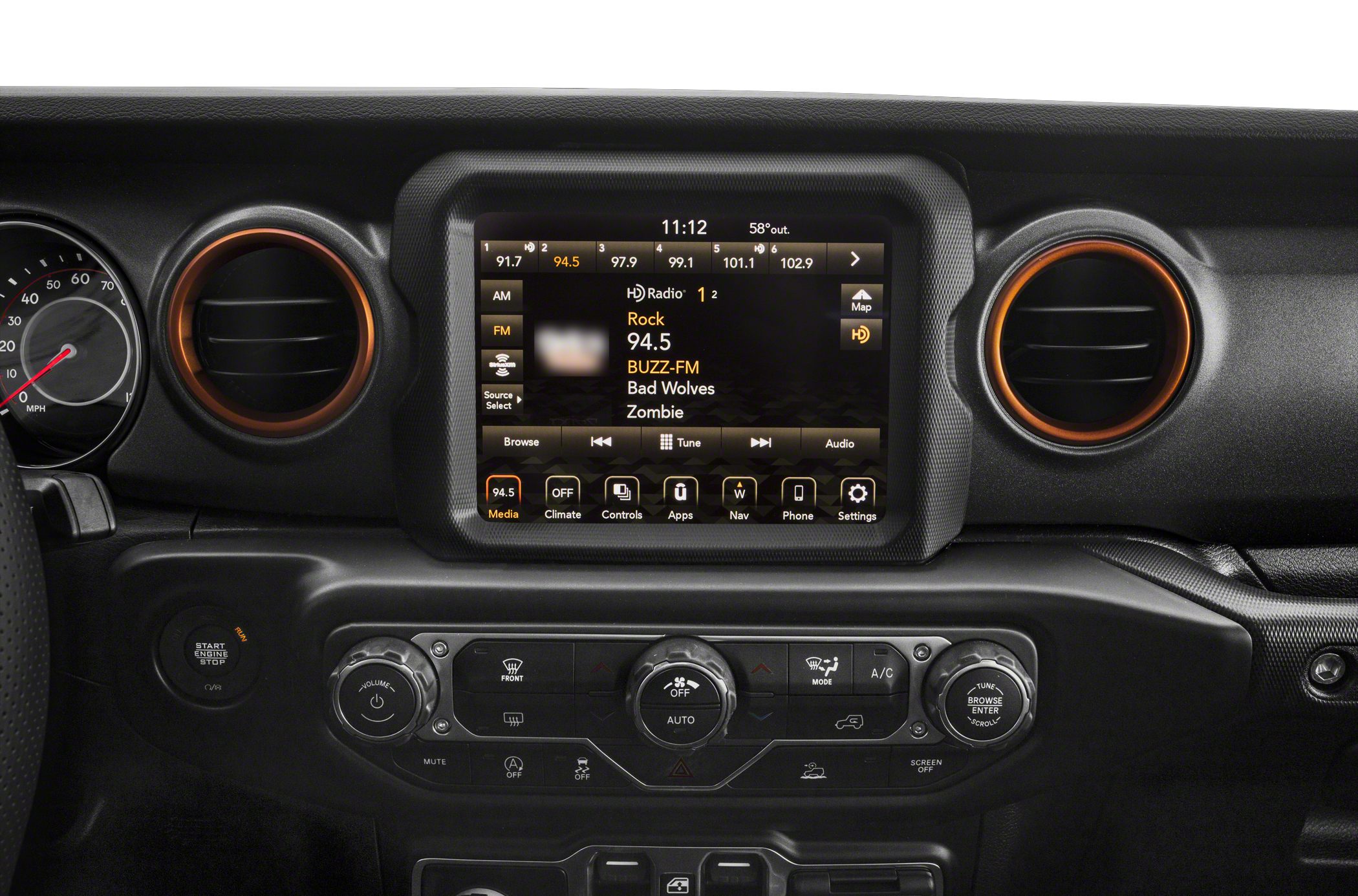 Touchscreen media display and circular air vents in vehicle dashboard