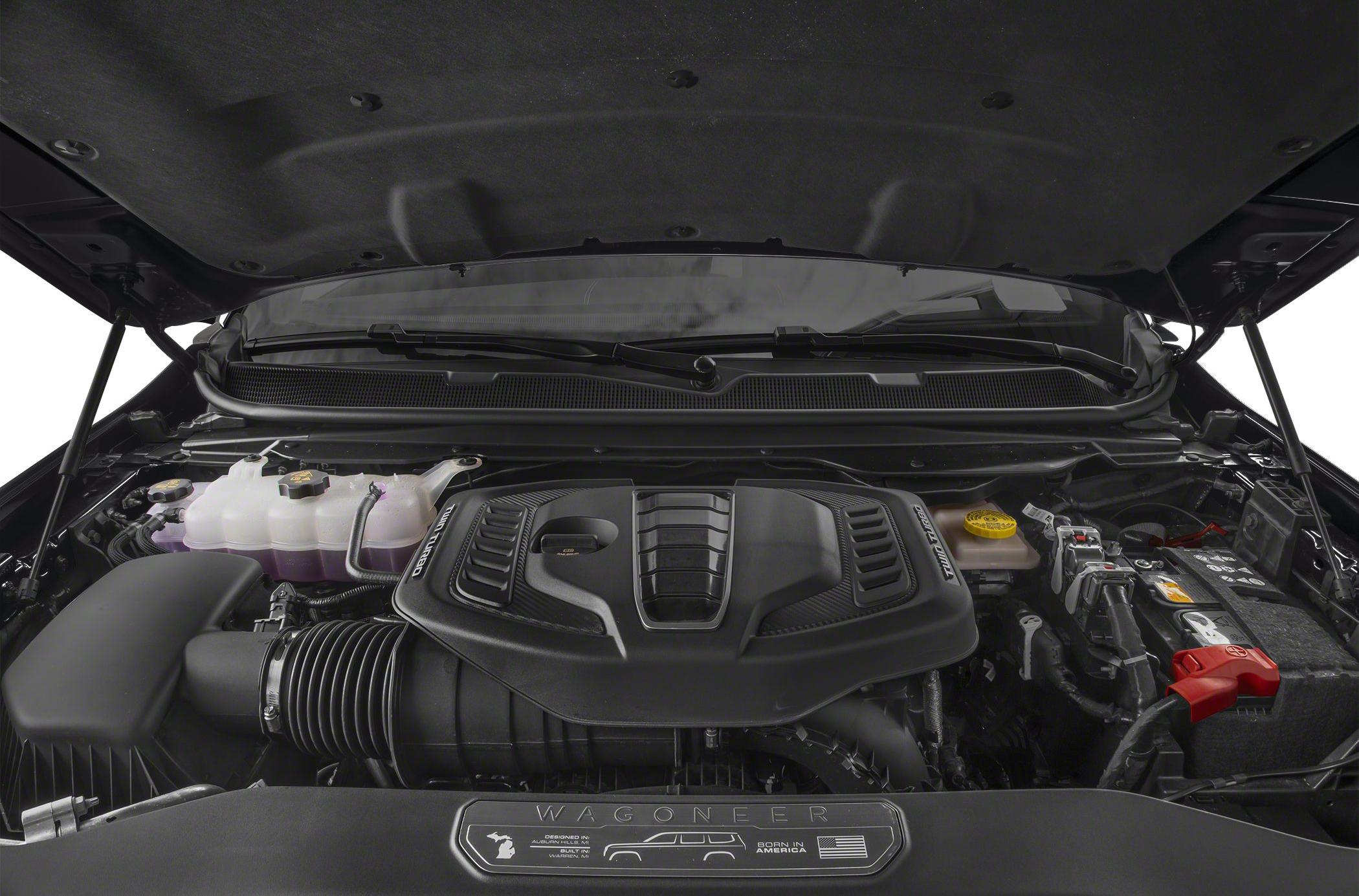 Twin turbo engine cover with advanced cooling system and battery compartment