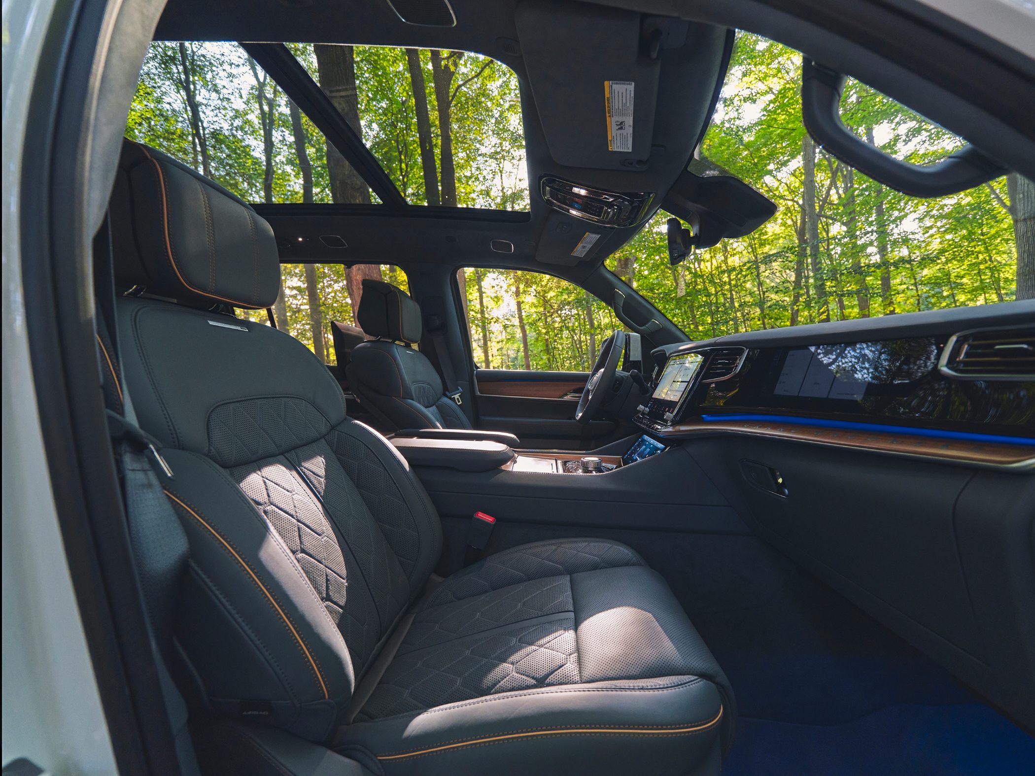 Luxury leather seats and panoramic sunroof in spacious cabin