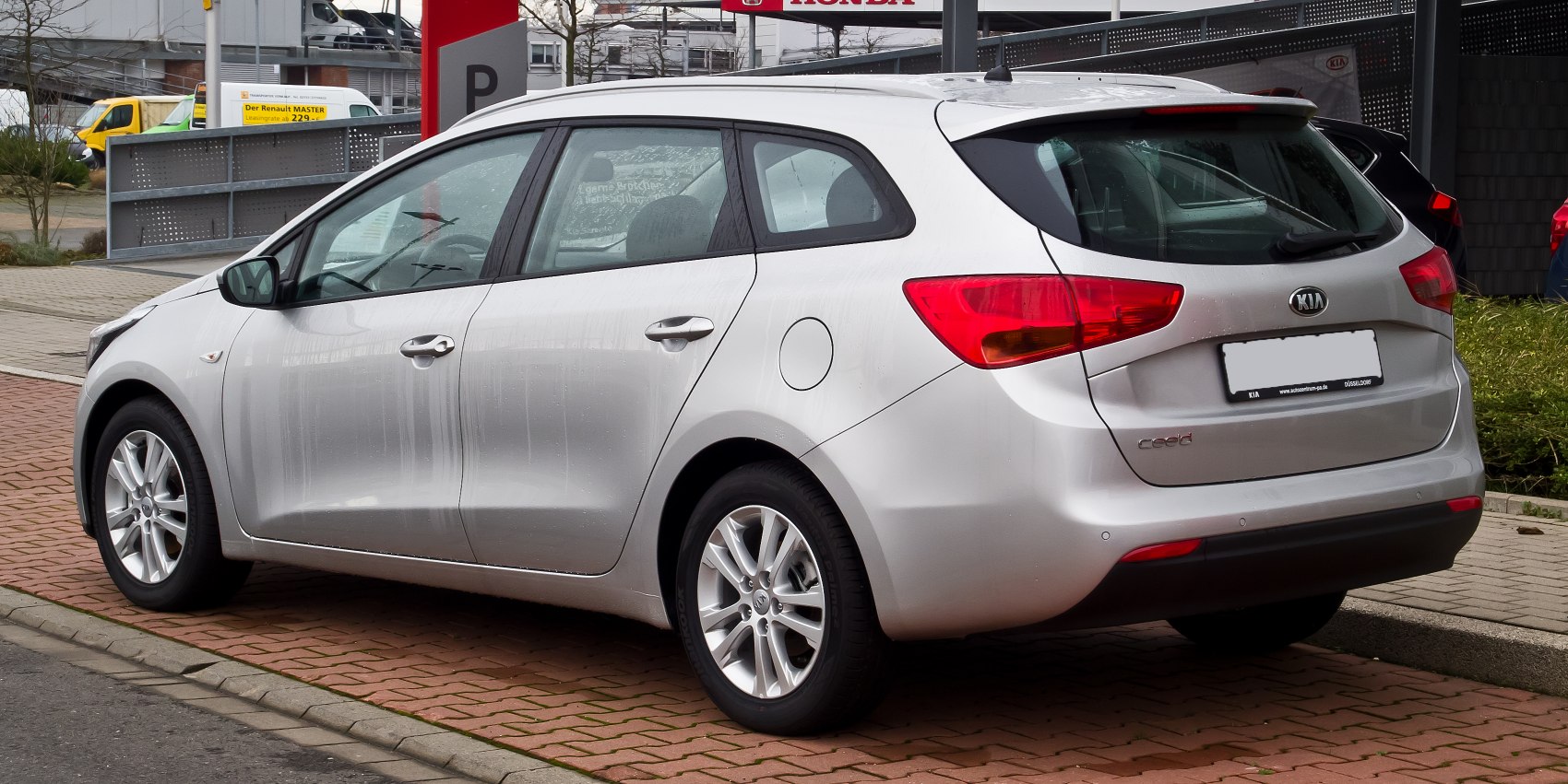 Silver station wagon rear and side angles with alloy wheels
