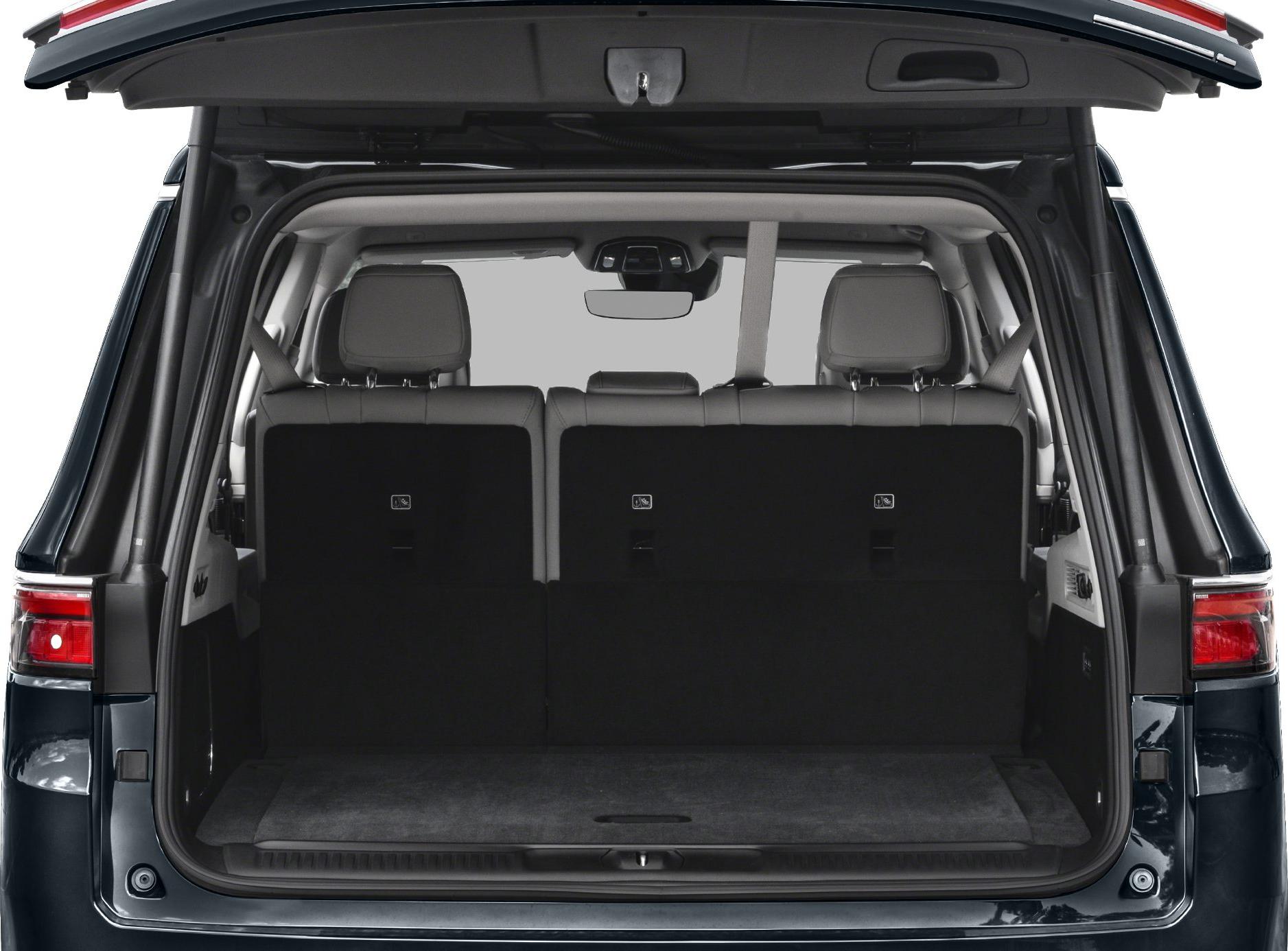 Rear cargo space with fold-down seats and headrests inside an SUV