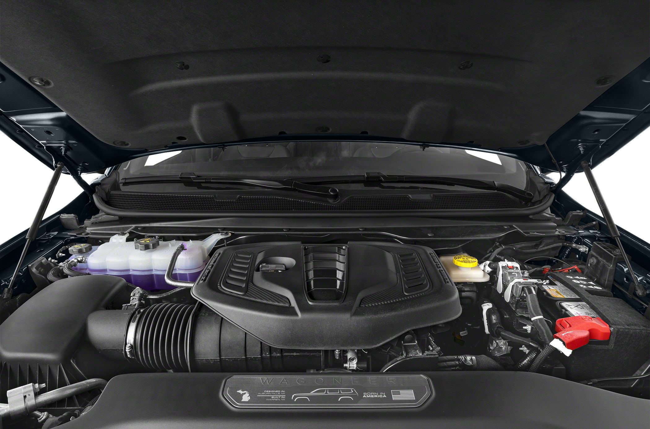 Modern engine bay with covered engine and components under hood