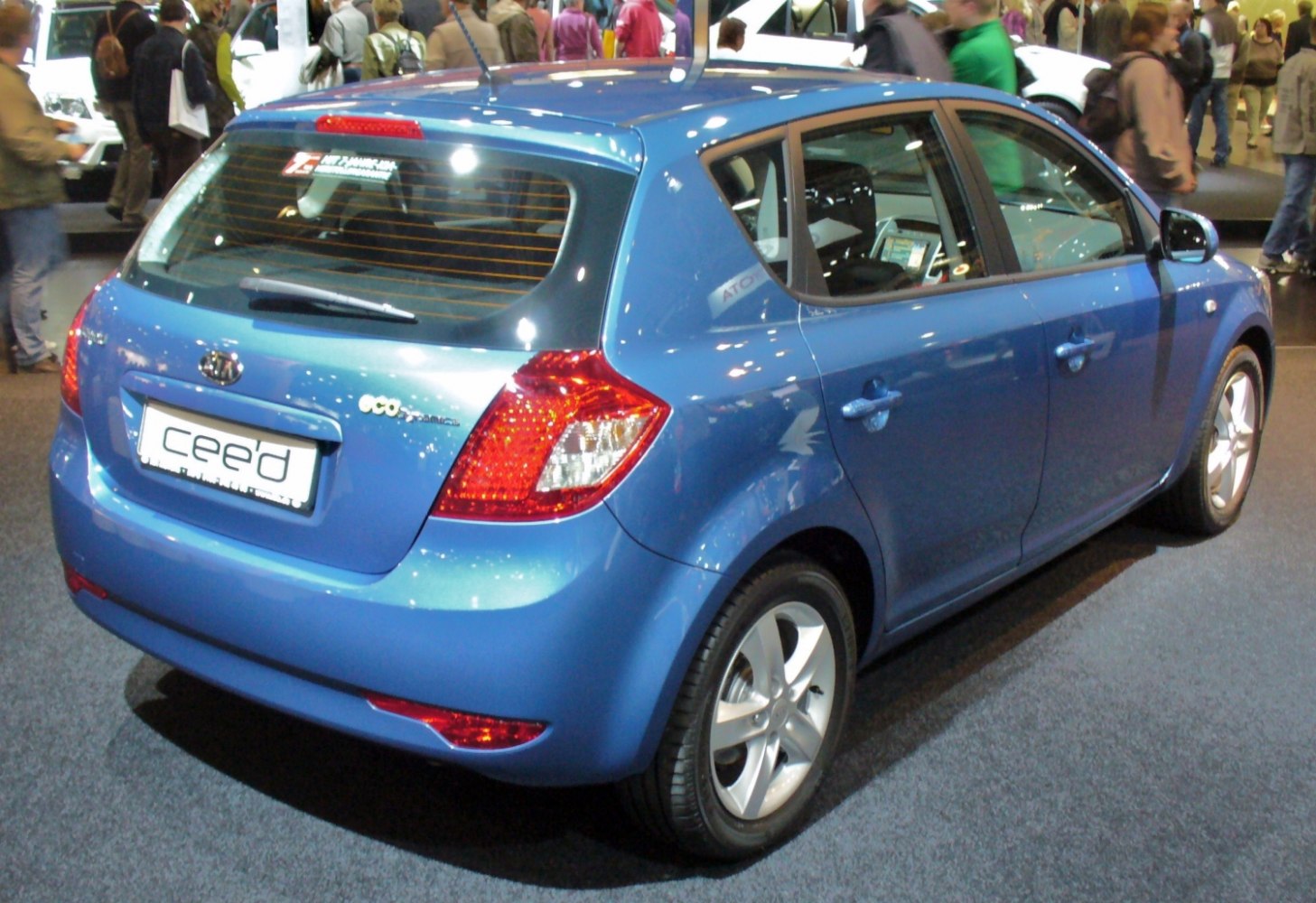 Rear view of a blue 5-door hatchback with distinct tail lights and compact shape