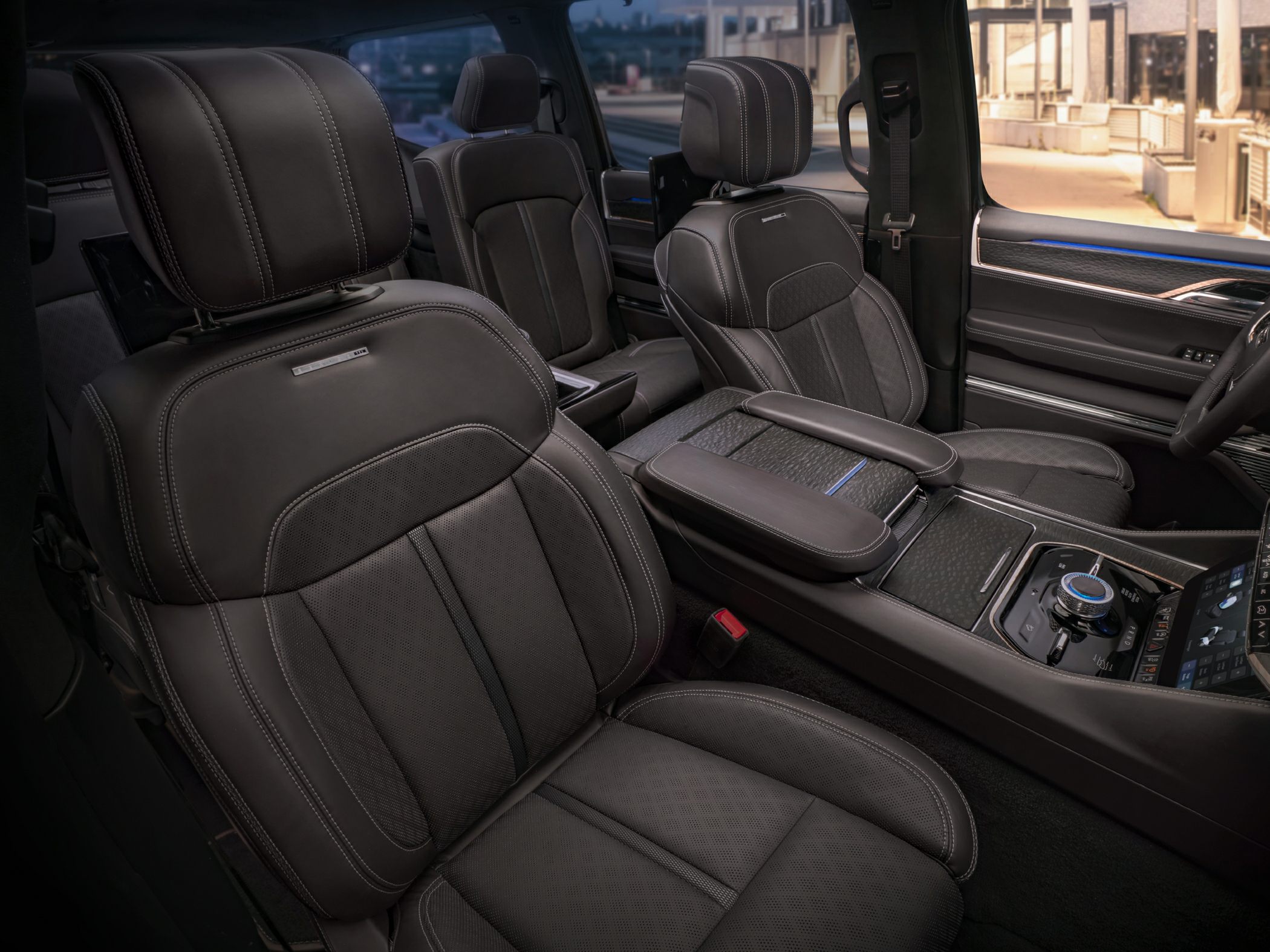 Black leather front seats and modern center console with controls