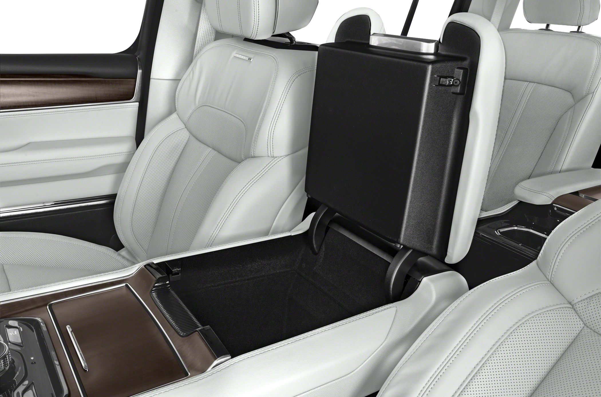 Center console storage compartment with white perforated leather seats