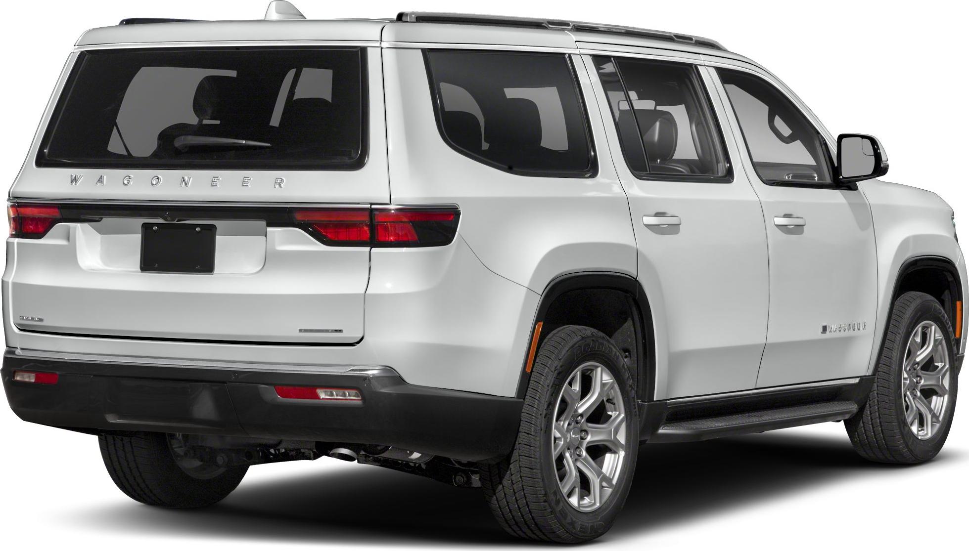 Rear and side view of a white full-size SUV with modern taillights and alloy wheels