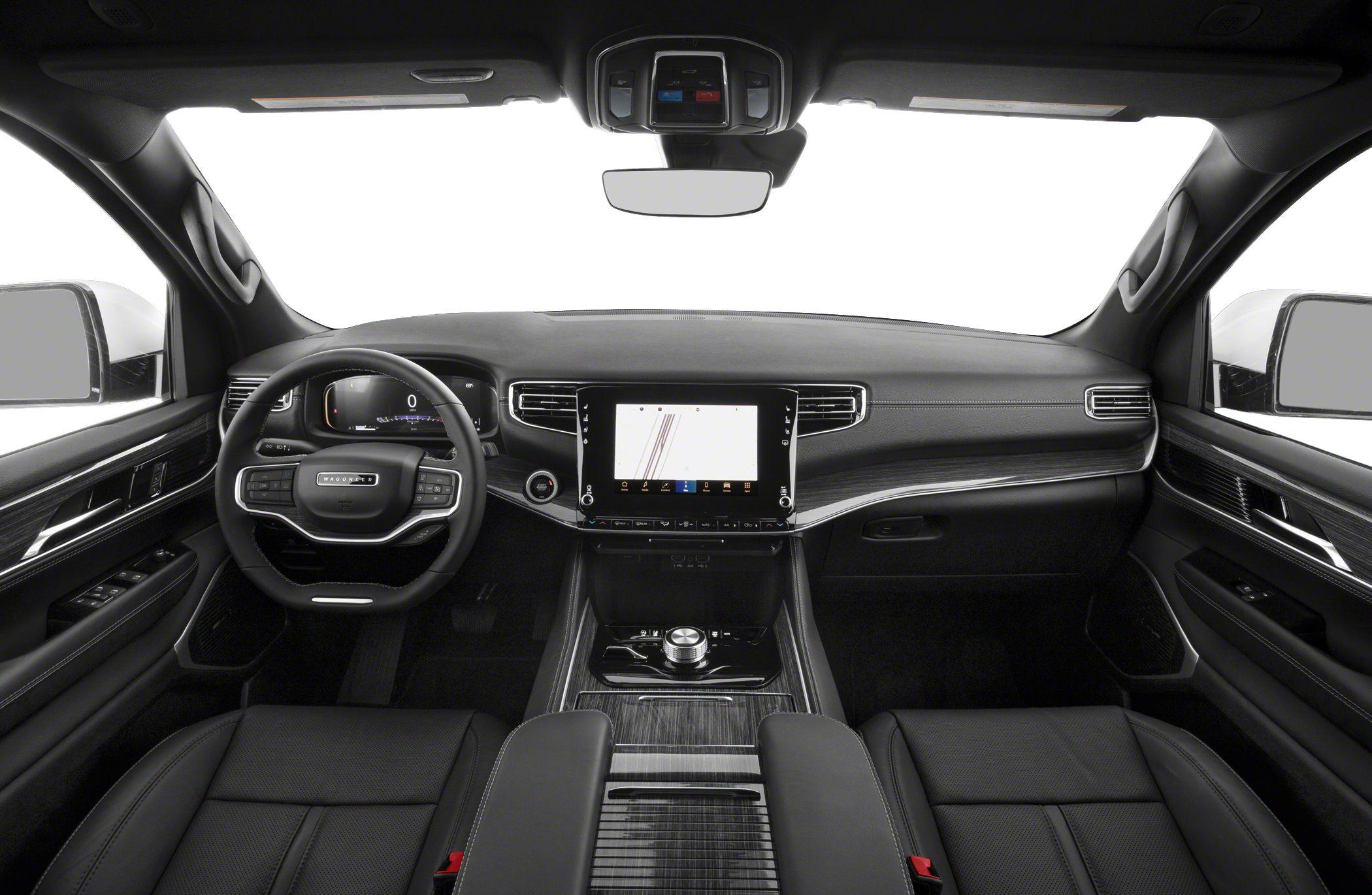 Luxury SUV interior with digital dashboard and touchscreen center display.