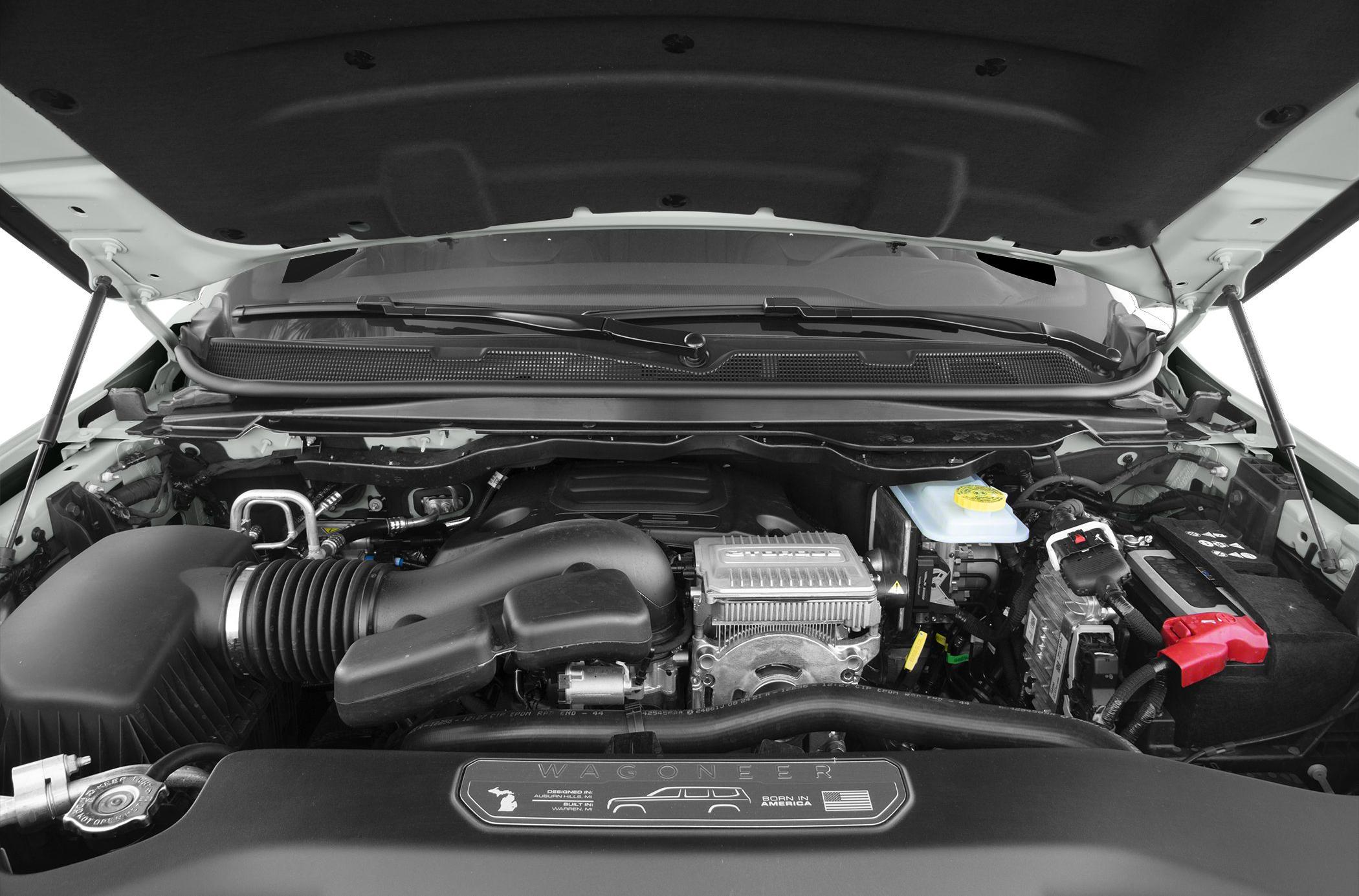 Engine bay with air intake and battery components under hood