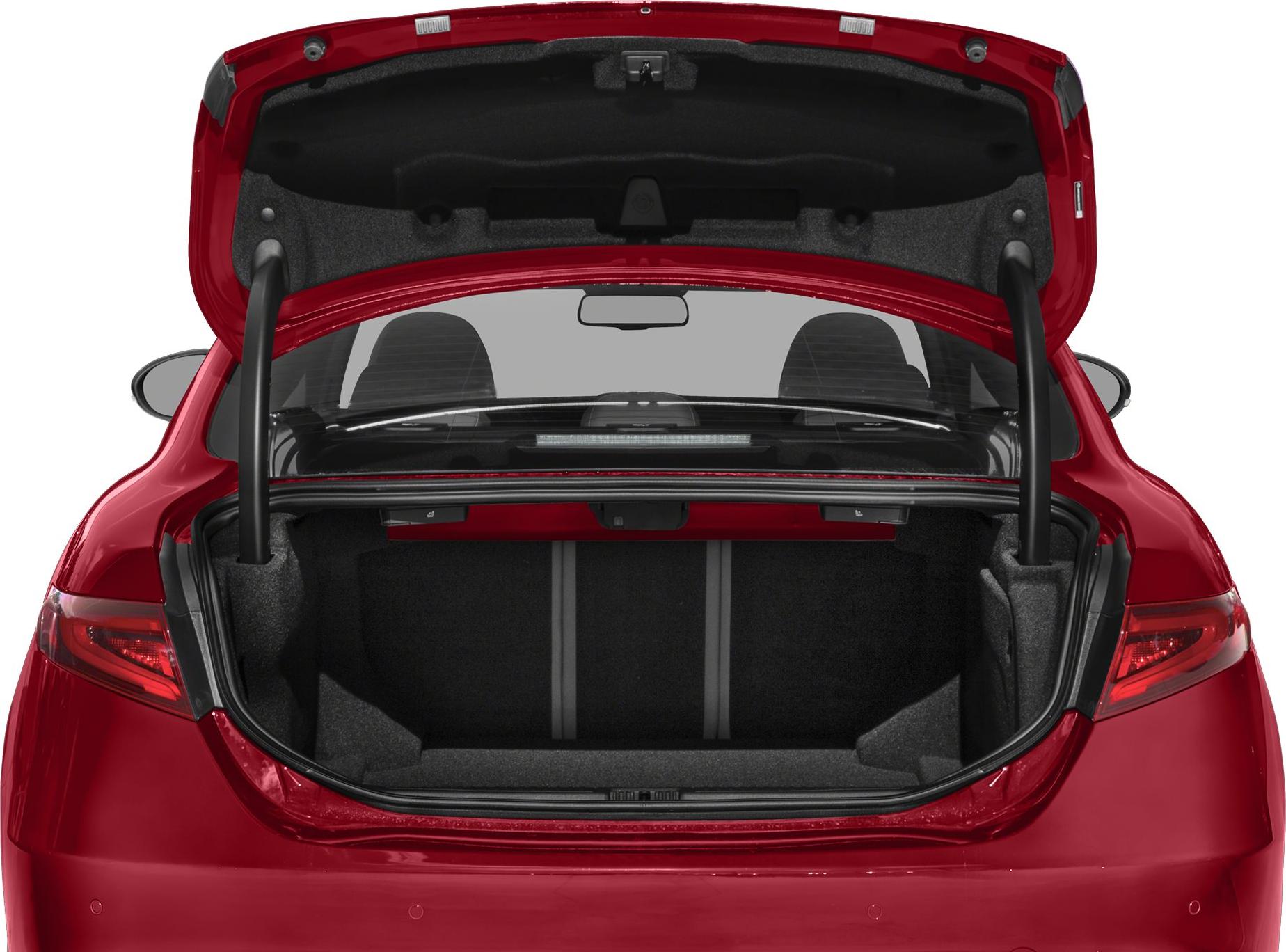 Spacious trunk interior of a red sedan with rear seats visible through rear window