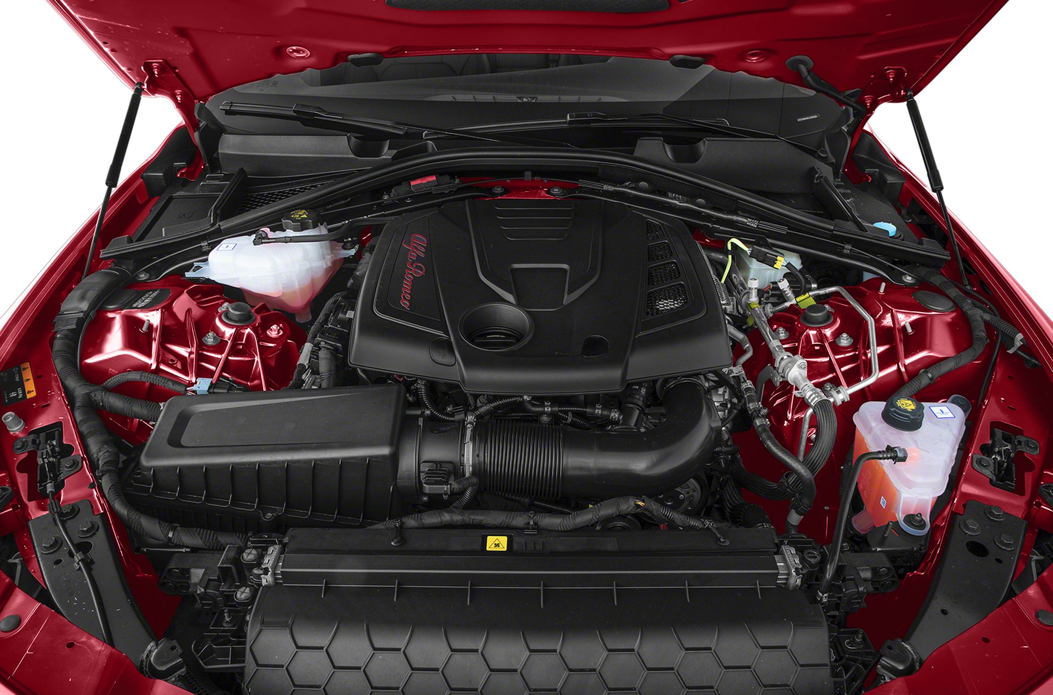 Close-up of Alfa Romeo Giulia engine bay with detailed engine cover and components.