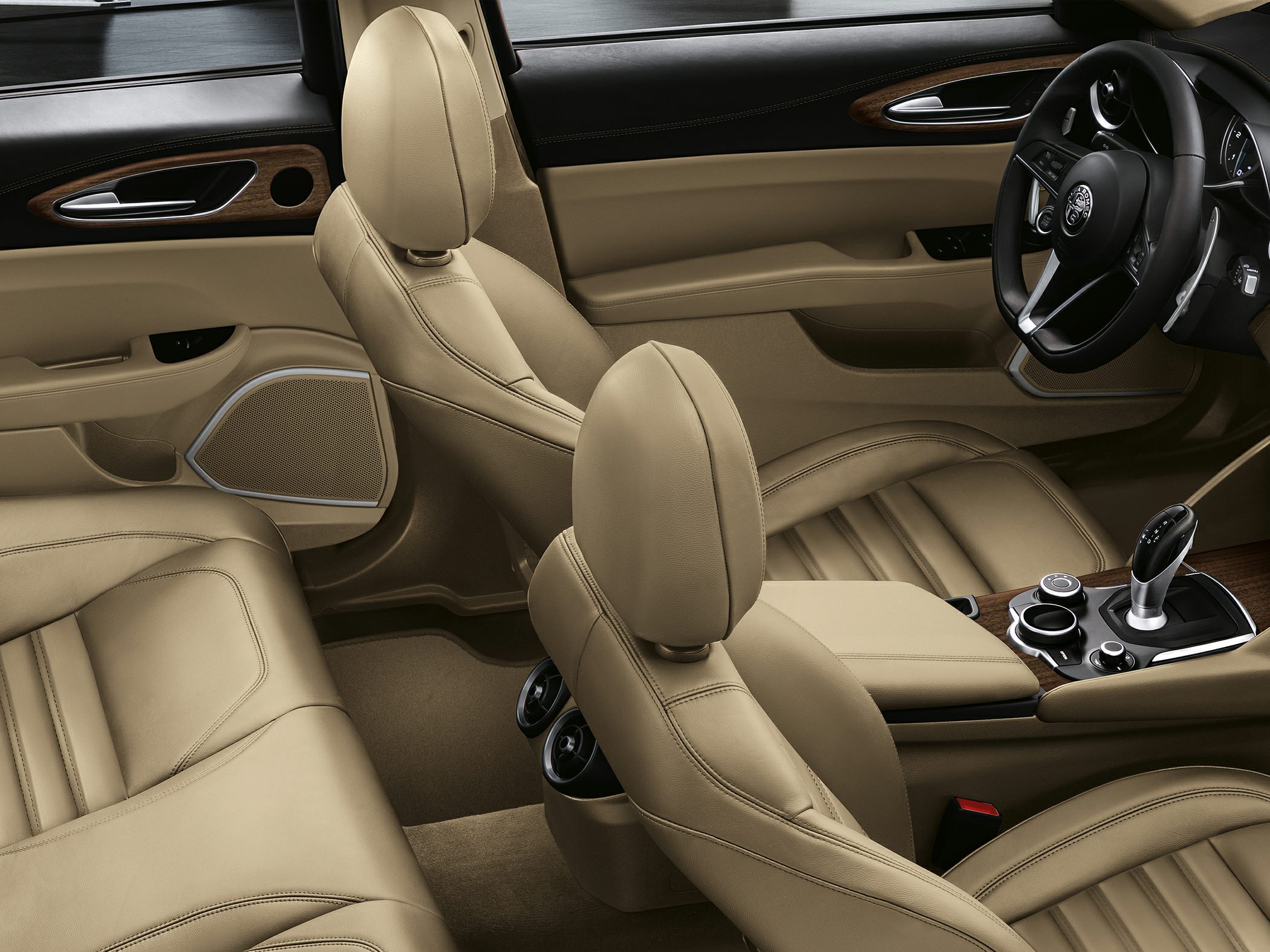 Beige leather seats and dashboard with wood trim and gear selector