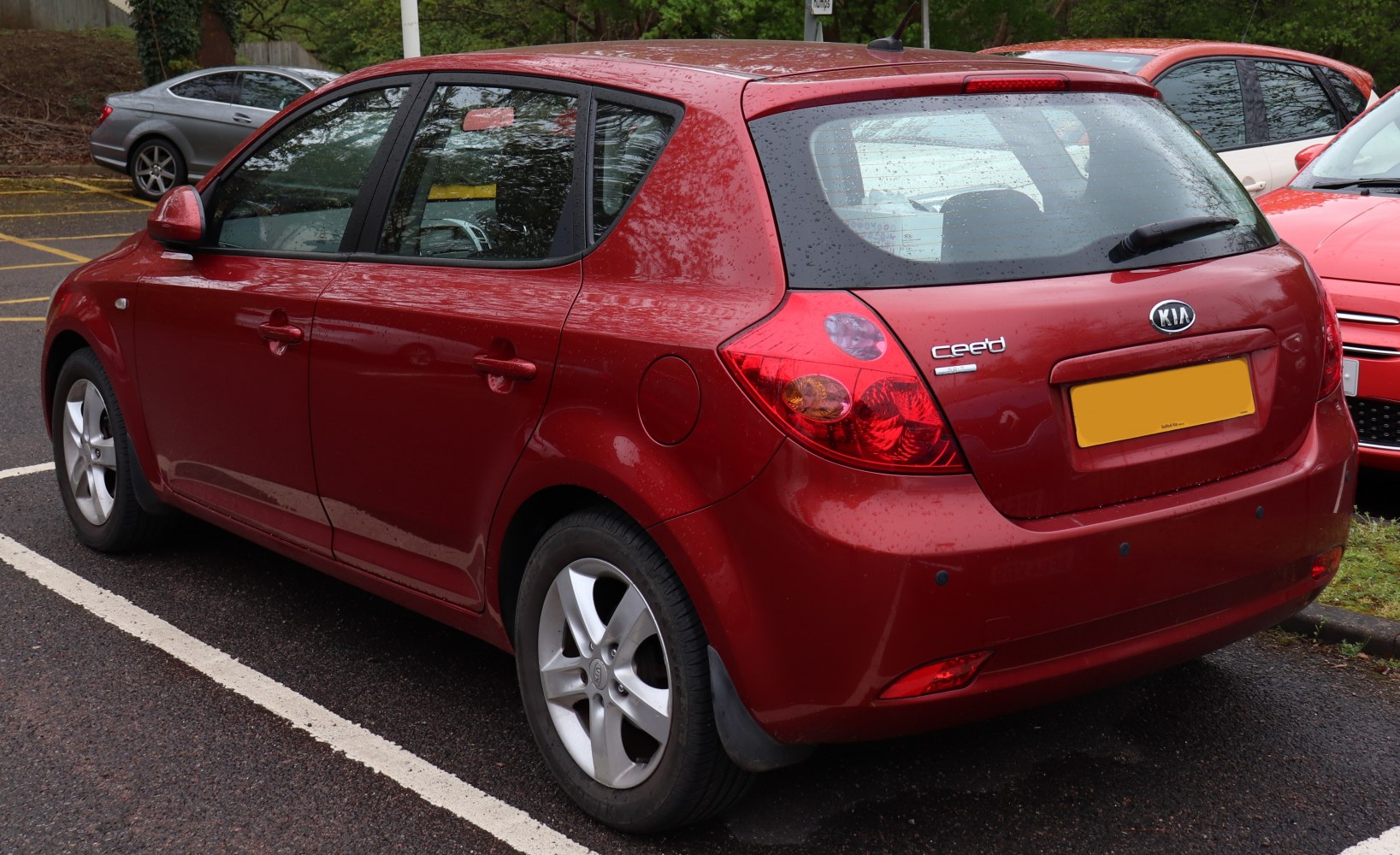 Rear and side profile of a hatchback with distinctive tail lights and alloy wheels.