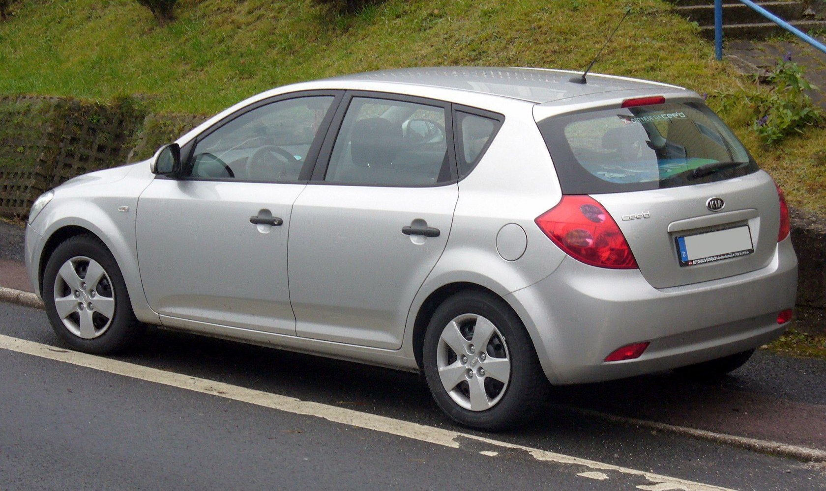 Silver 5-door hatchback rear and side view with distinctive tail lights