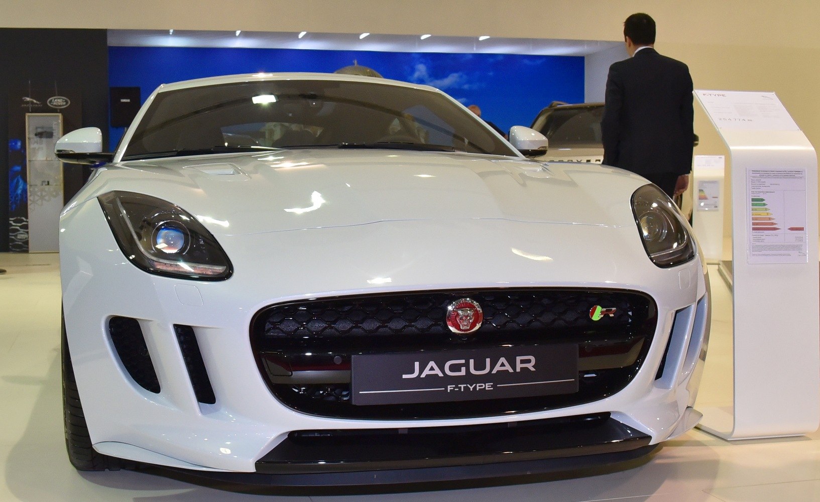 Front view with sleek headlights and honeycomb grille