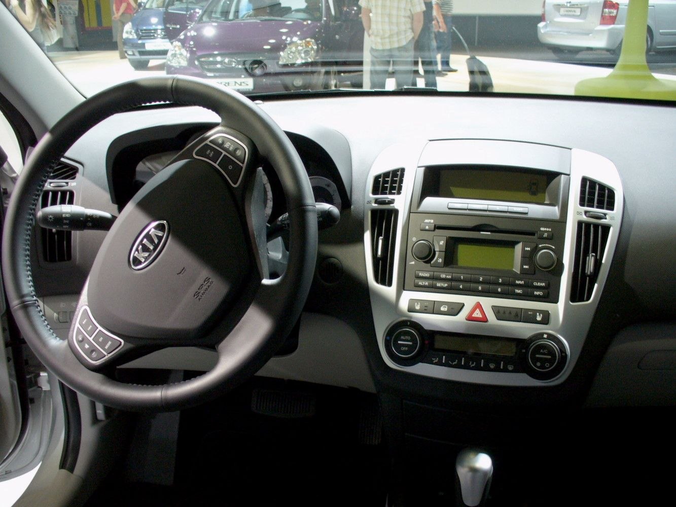 Steering wheel and dashboard with central console and controls